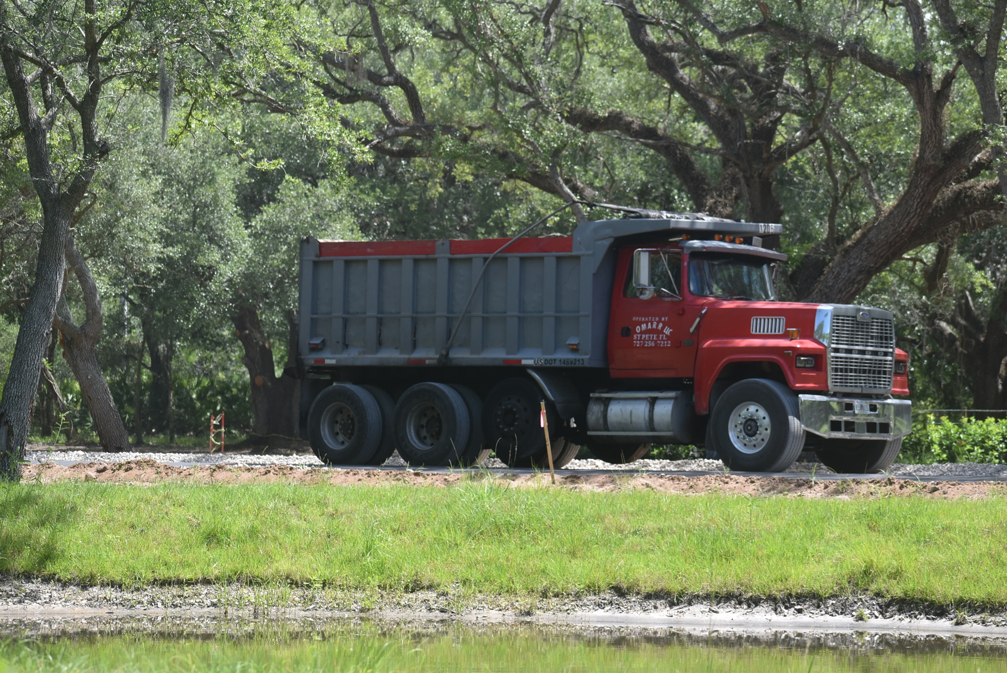 A dump truck leaves the Mallaranny property on April 29. Russell Ireland, who lives next door, said trucks continue to bring dirt into the property even though the property's manager said he would stop in March.