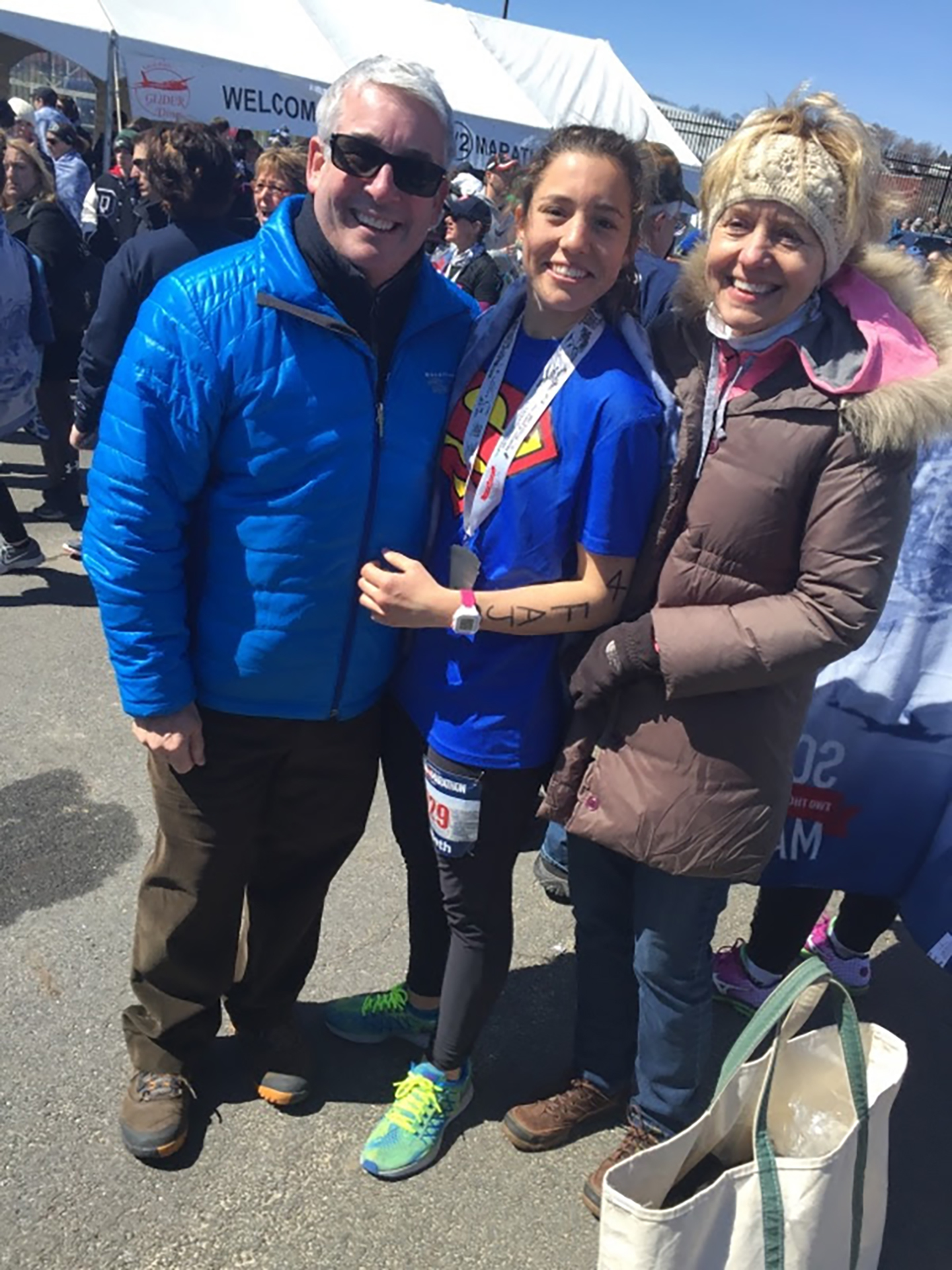Joseph Zajac celebrates his daughter, Liz Gutierrez's completion of her first half marathon, with his wife, Nancy Zajac. Courtesy photo.