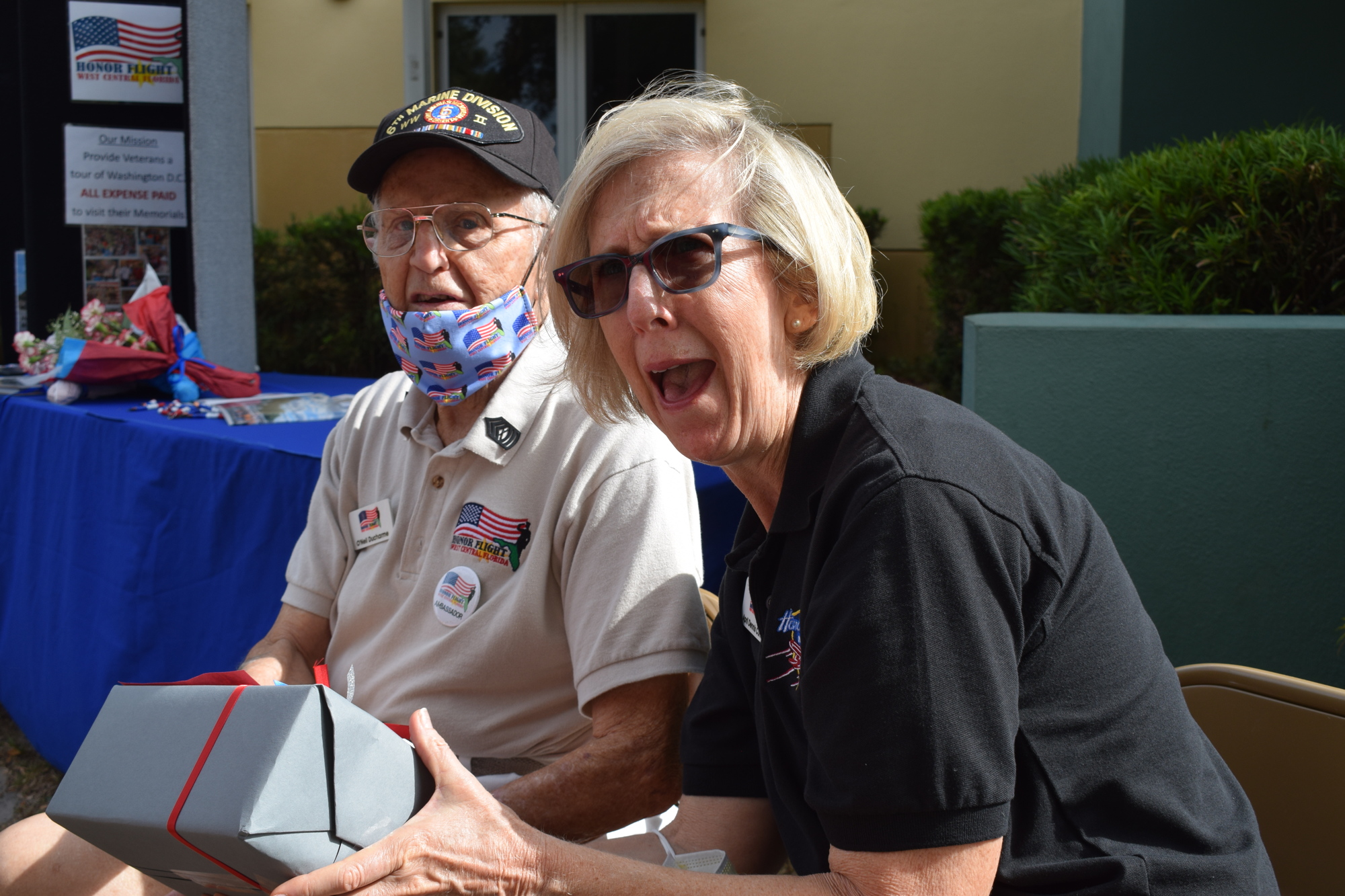 O'Neil Ducharme, a Marine Corps veteran, and April Currie, the president of Honor Flight of West Central Florida, are blown away by the $3,468 donation Olivia Swartling's fifth grade class at McNeal Elementary gave to Honor Flight