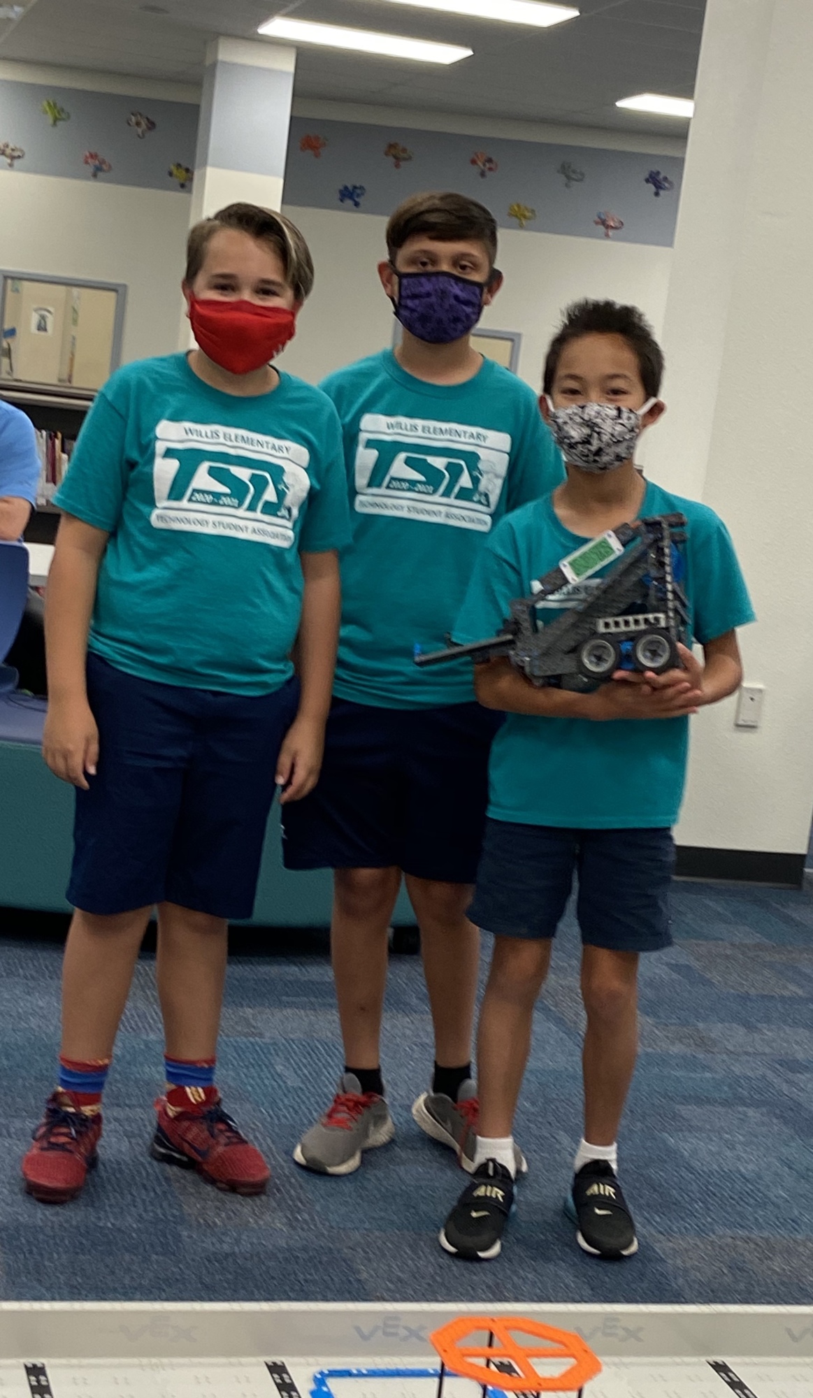 Logan Scheuerman, Jack Carlson and Magnus Tilton, who are fifth graders at Robert E. Willis Elementary School, are part of the Gray Geckos VEX team. The millage helps support programs like the VEX program. Courtesy photo.