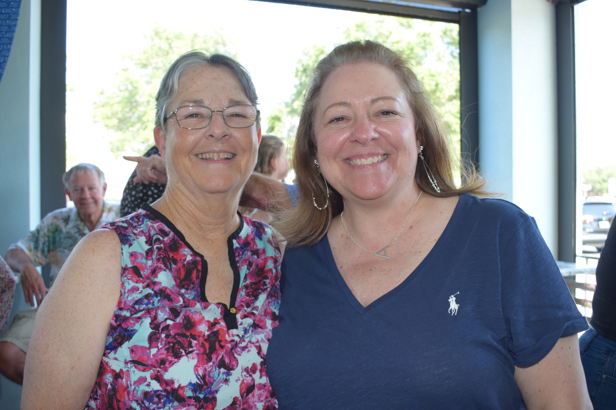 Candice DeLazzer, an English teacher at Lakewood Ranch High School, celebrates her retirement with Macie Adams, who was a cheerleader for DeLazzer at Southeast High School before becoming a colleague of DeLazzer's.