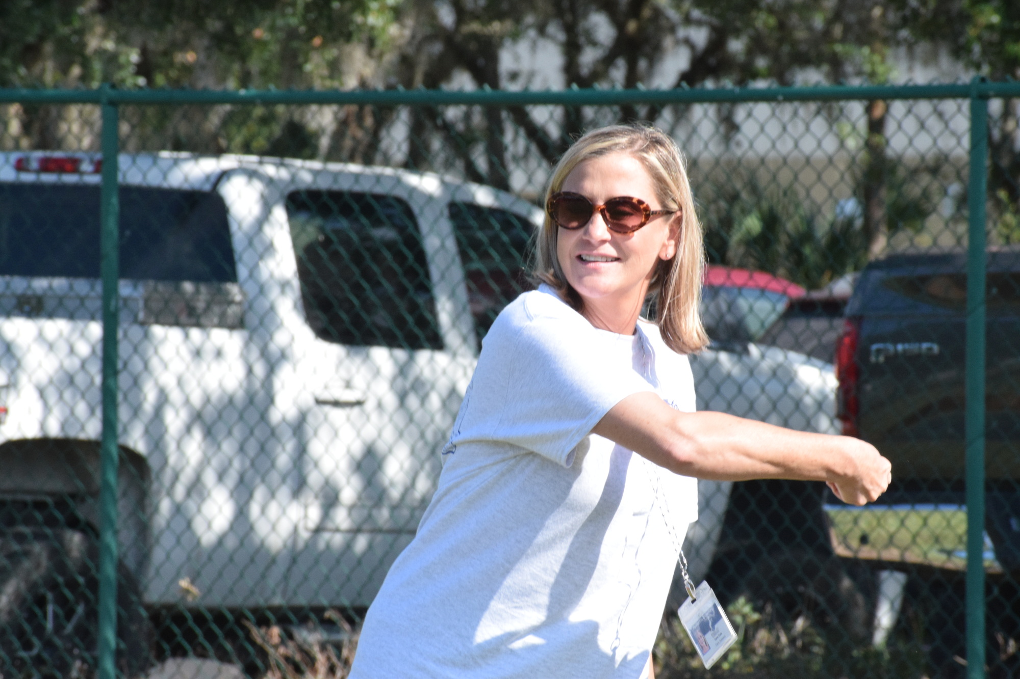 Gena Case, a guidance clerk at Myakka City Elementary School, follows the School District of Manatee County guidelines when not wearing a mask outside. She's excited she won't have to wear a mask next school year.