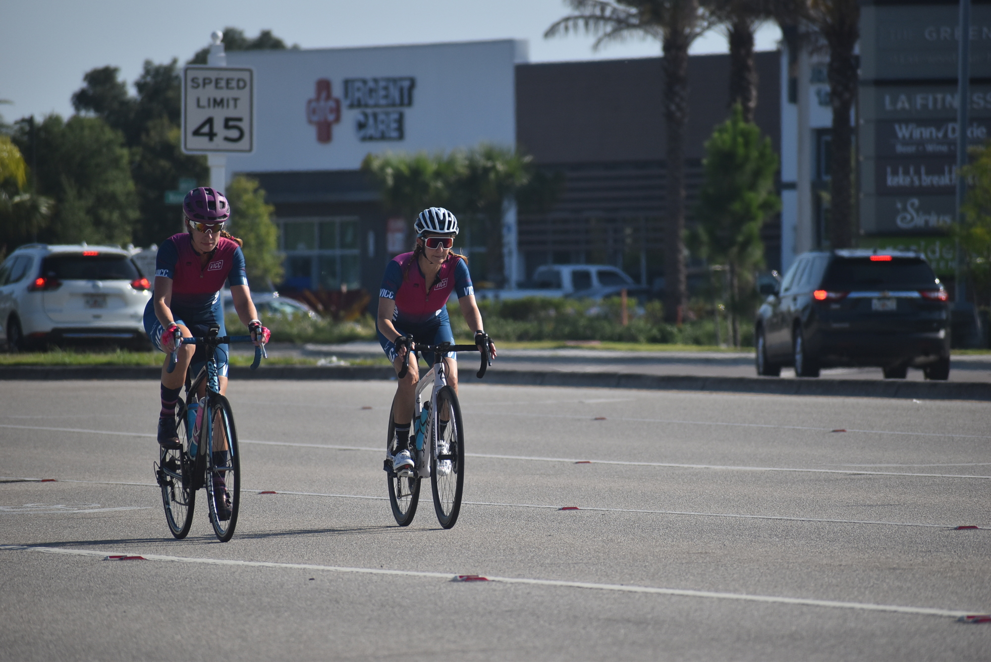 Village Idiots Cycling Club members Dawn Zielinski and Andrea Sacchetti ride on southbound Lakewood Ranch Boulevard before entering the intersection with State Road 70.