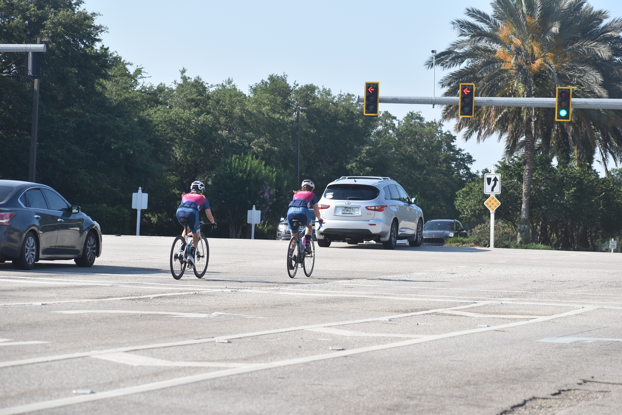 Village Idiots Cycling Club members Andrea Sacchetti and Dawn Zielinski ride on southbound Lakewood Ranch Boulevard before entering the intersection with State Road 70.
