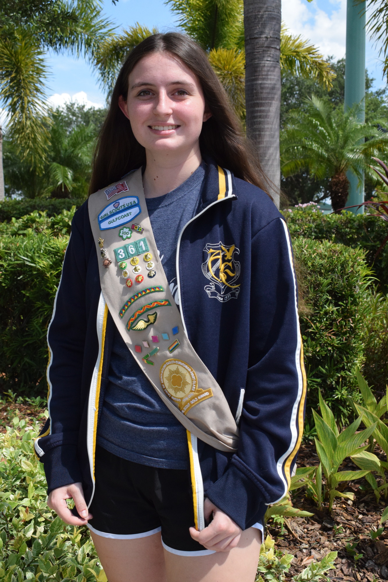 Sydney Shepard earns her Girl Scout Gold Award by developing a garden for residents at DeSoto Beach Club and helping residents garden. Photo by Liz Ramos.