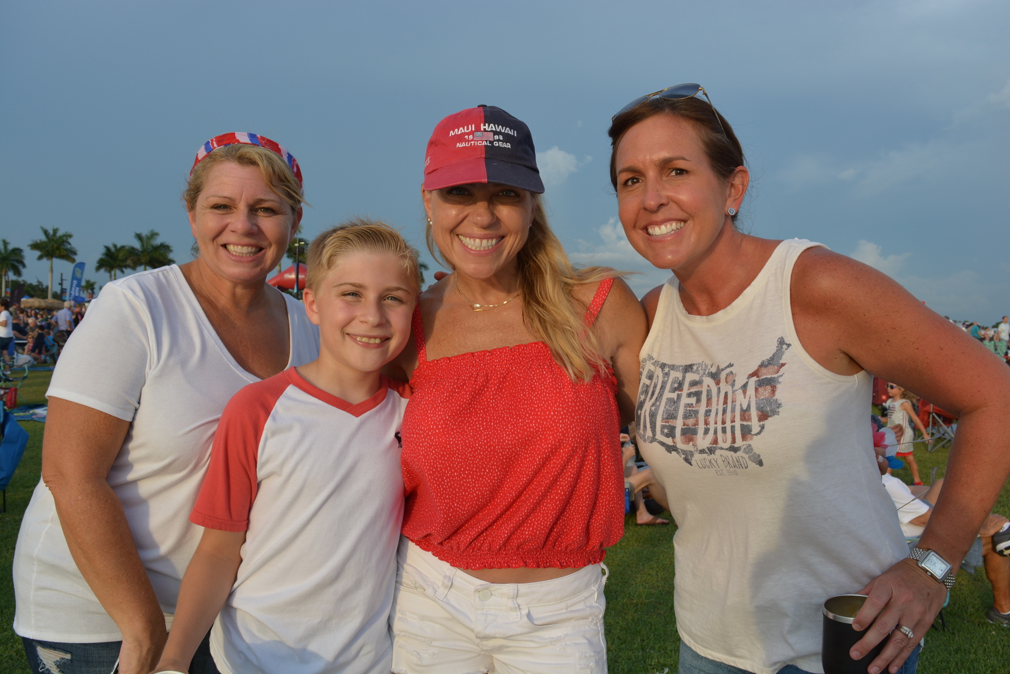 Lakewood Ranch's Keri Langlois, Bryce and Jenn Wilson and Michelle Smith watch their friend Kristen Labatsky complete the Fireworks 4-Miler On The Lake as they listened to music by the Greg Billings Band in 2019. File photo.