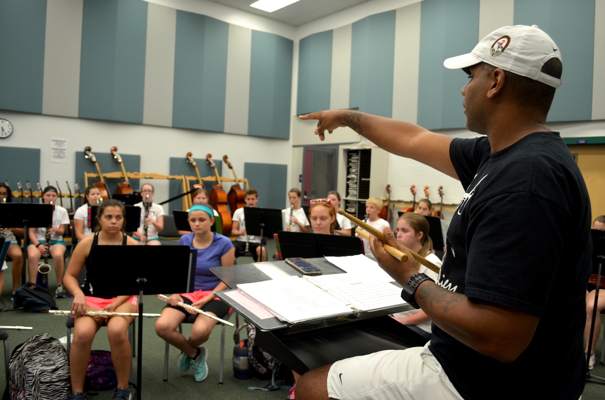 Ron Lambert, the director of bands at Lakewood Ranch High School, leads the band through rehearsal. File photo.