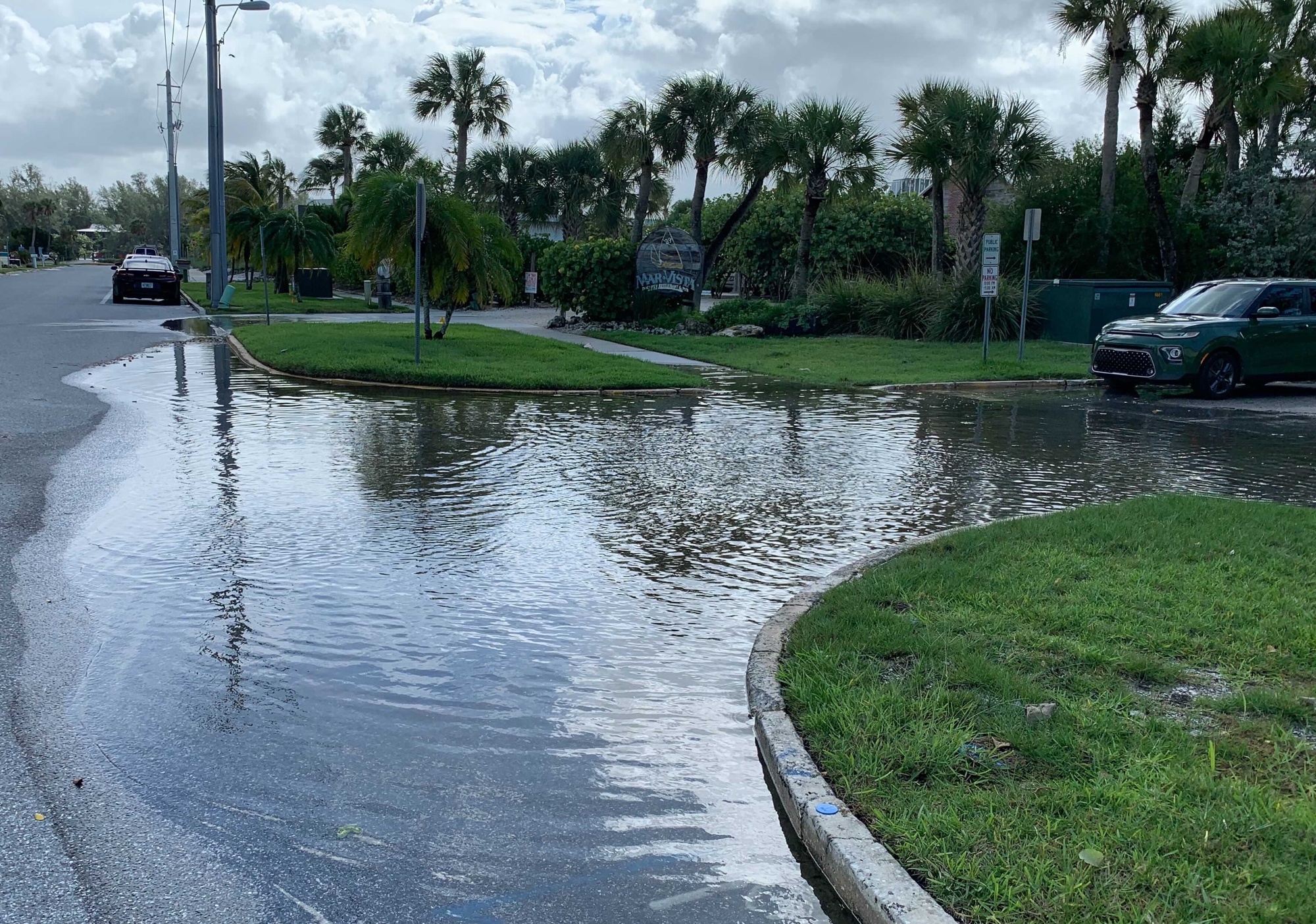 A few inches of water remains pooled at the corner of Broadway Street and Lois Avenue in Longbeach Village.