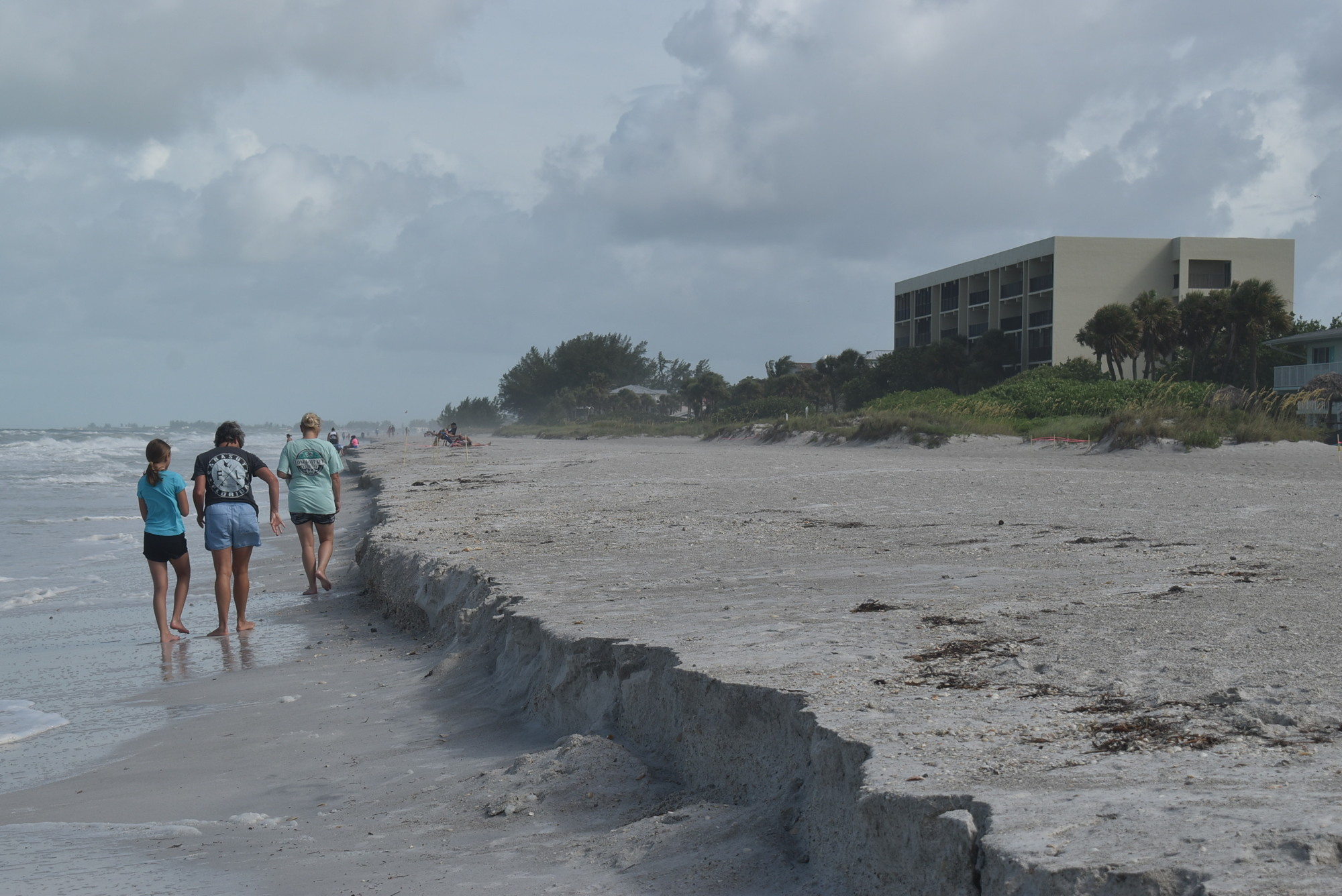 Amy Baker, Lysette Daniels and Marisa Baker check out the beach erosion in the 3100 block of Gulf of Mexico Drive in Longboat Key.