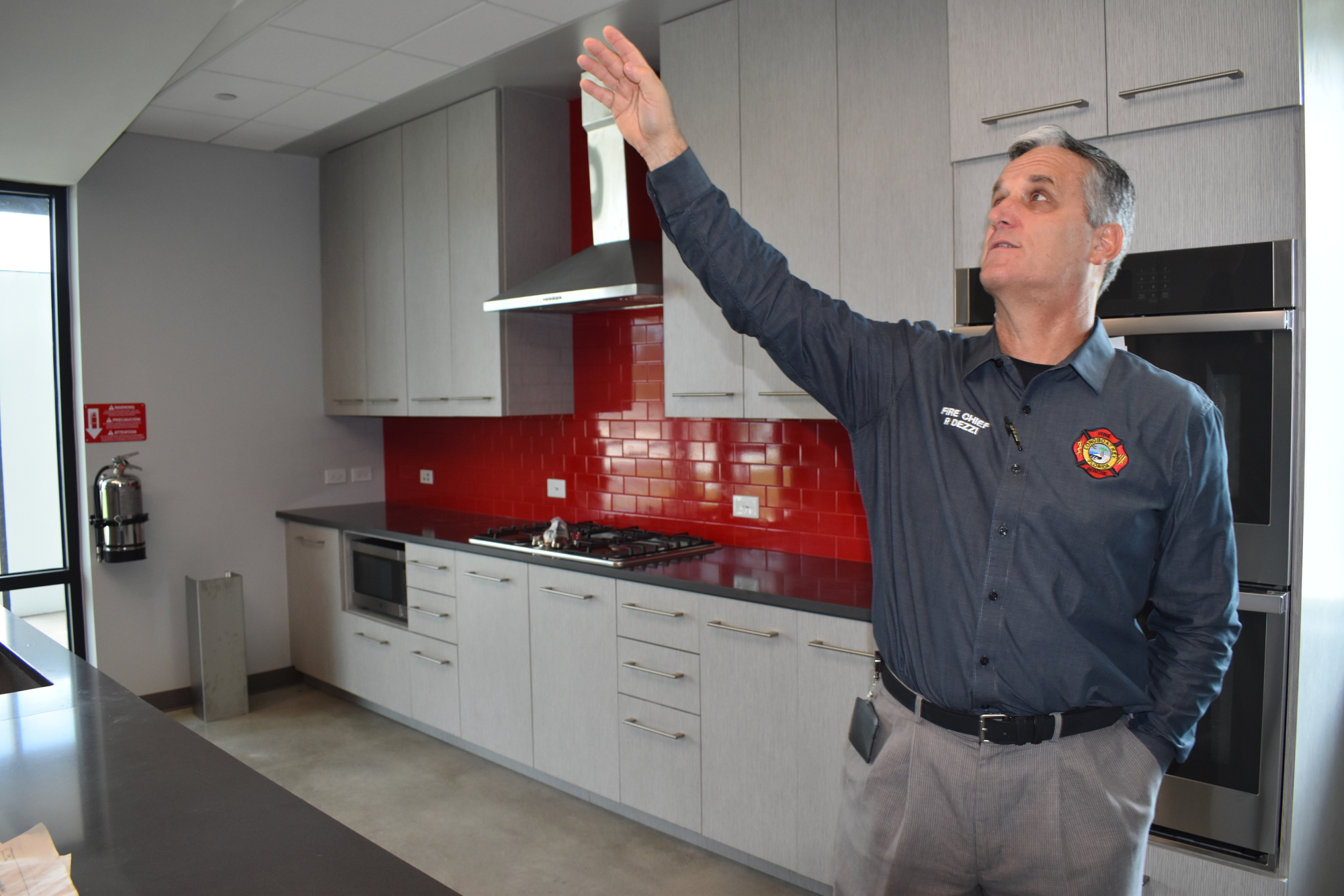Fire Chief Paul Dezzi shows some of the different features of Fire Station 92's kitchen.