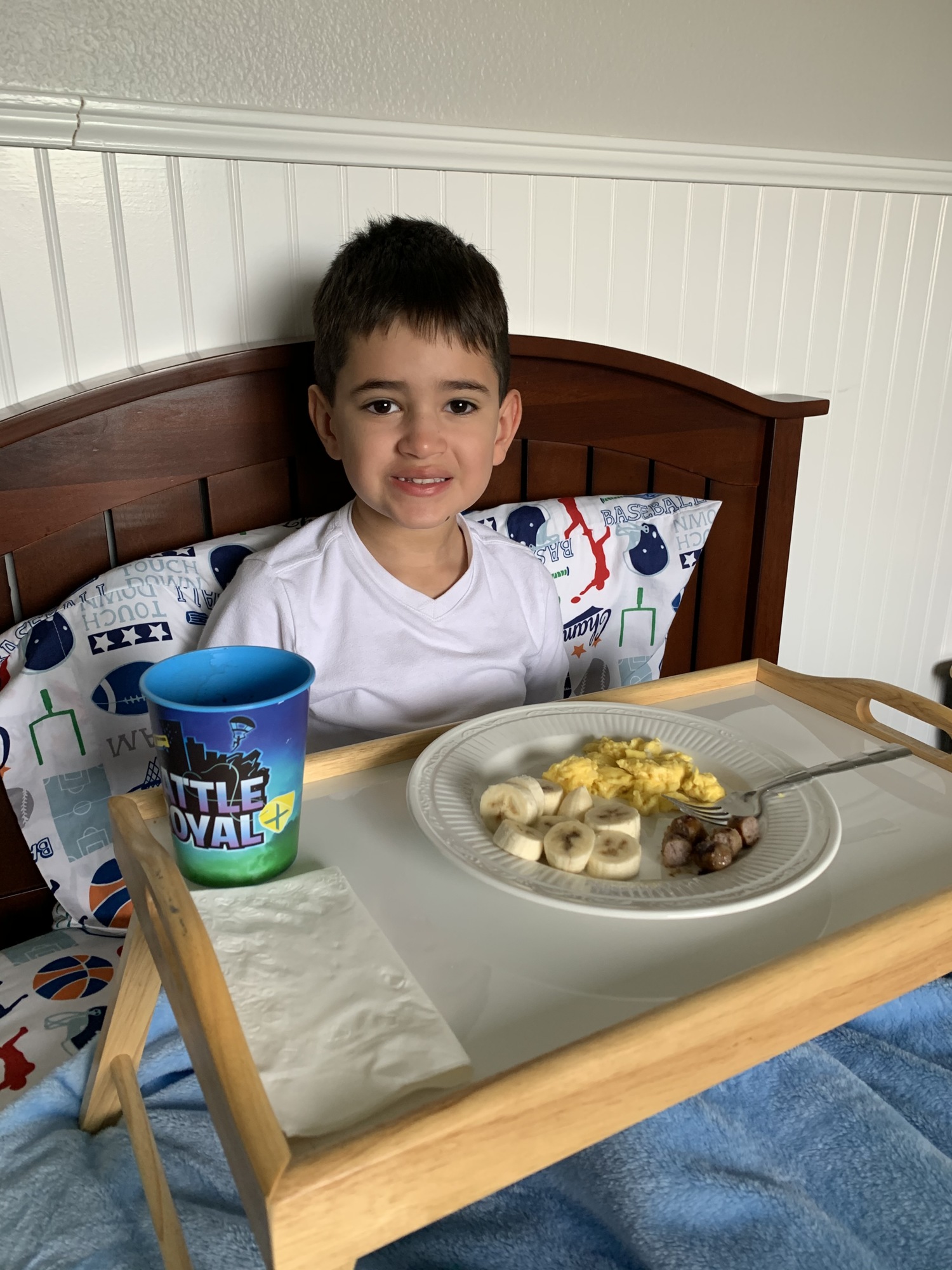 Reed Holland enjoys a special breakfast in bed his mother Cristina Holland made for him to celebrate the first day of school. Courtesy photo.