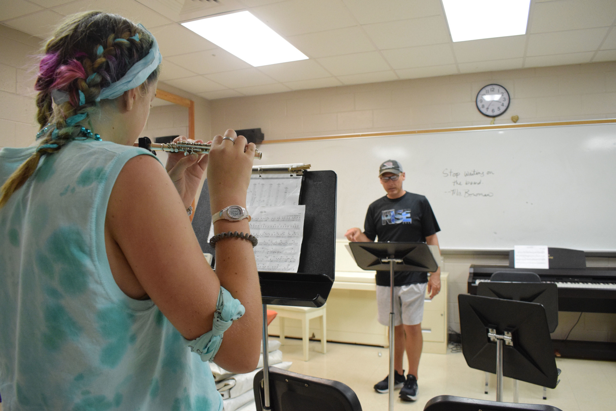 Carissa Bailey plays her solo as Cliff Dawson, the new director of bands, directs.