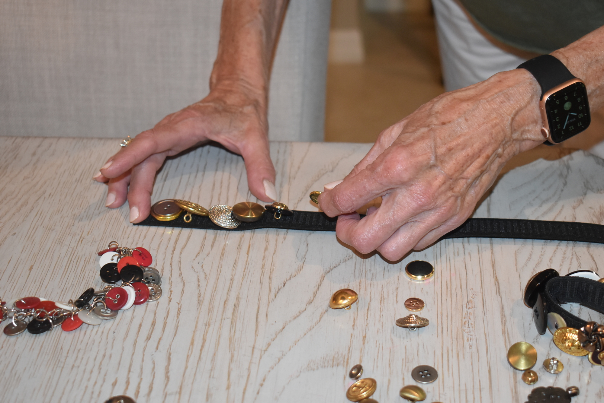 University Park resident Marlene Meyer, who owns Marlene's Finds and Designs, often uses customers' old buttons to create new items such as bracelets.