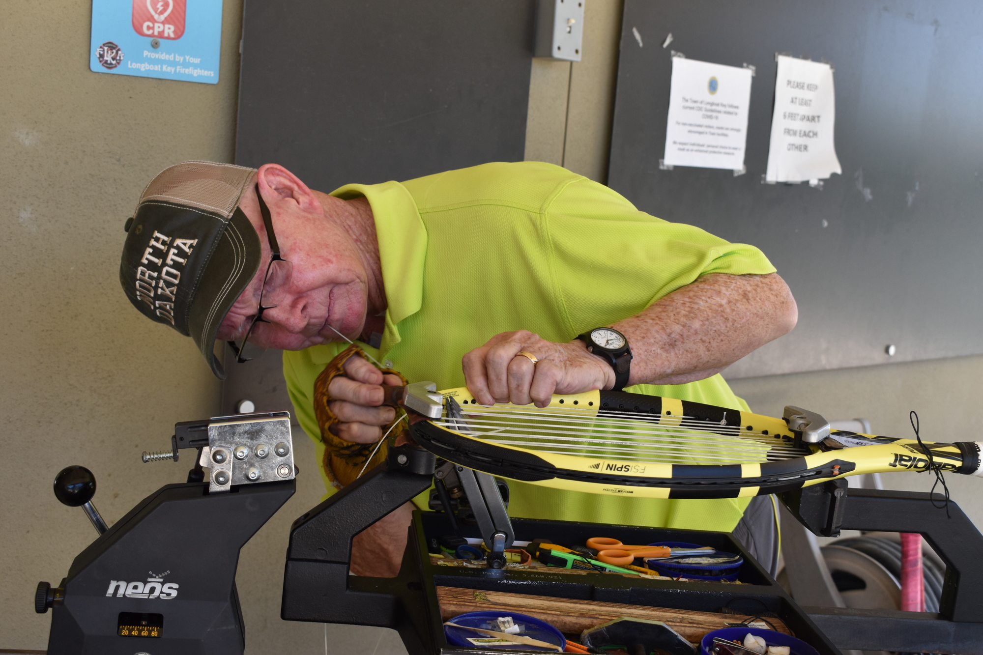It takes Jay Morgan about 30-40 minutes to restring a tennis racket.