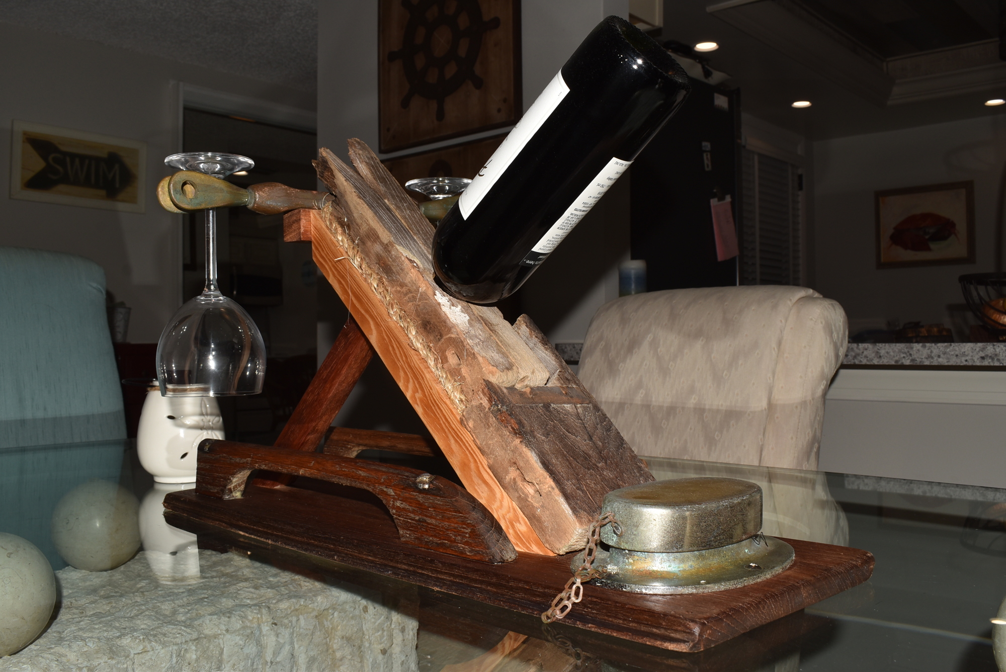 Mike Ciccone built a wine bottle holder from the remains of the sailboat.