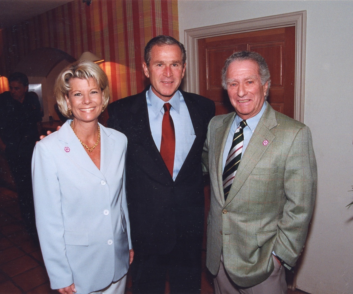 Katie Klauber Moulton, President George W. Bush and Murf Klauber pose for a photo at the Colony Beach and Tennis Resort on Sept. 10, 2001. File photo