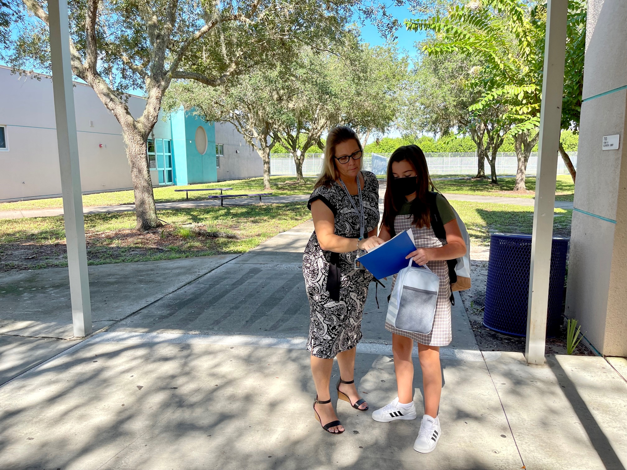 Kate Barlaug, the principal of Carlos E. Haile Middle School, helps a student navigate her way around campus. Photo courtesy of the School District of Manatee County.
