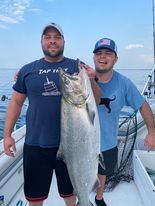 Ryan and Trevor Kelliher show off Trevor's catch on a recent fishing trip.