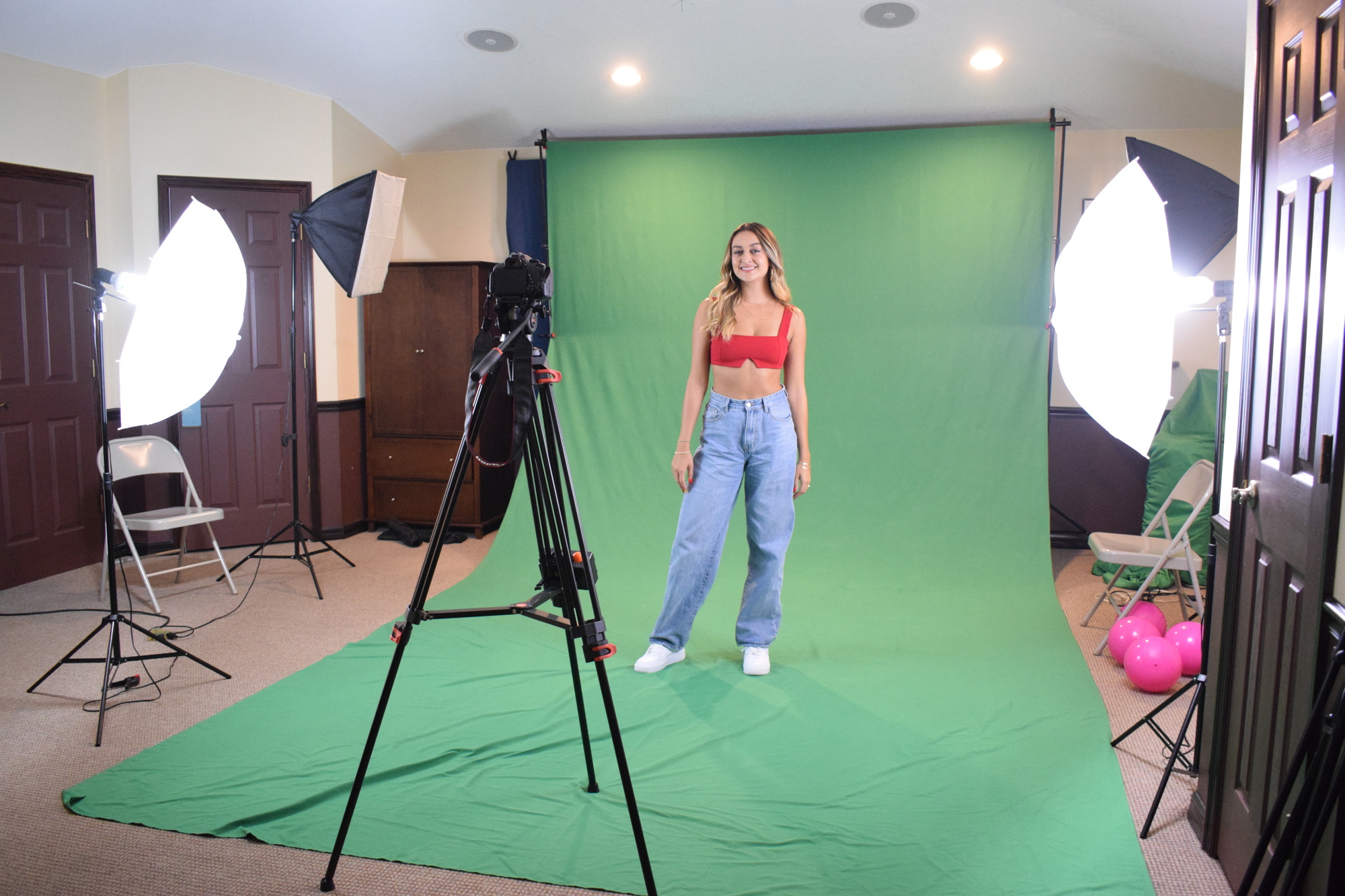 iLana Armida uses the green screen and other equipment in her home to create a music video for her song 