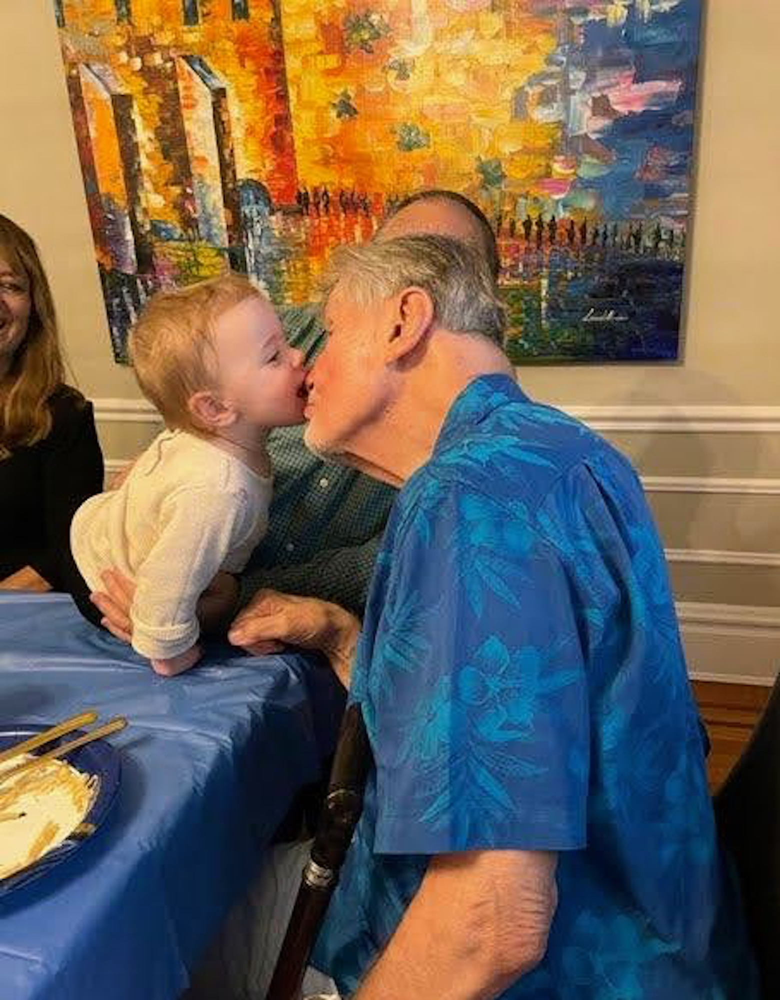 Ed Krepela gets a peck on the nose from Molly, one of his great-grandchildren whom he had never met. Courtesy photo.