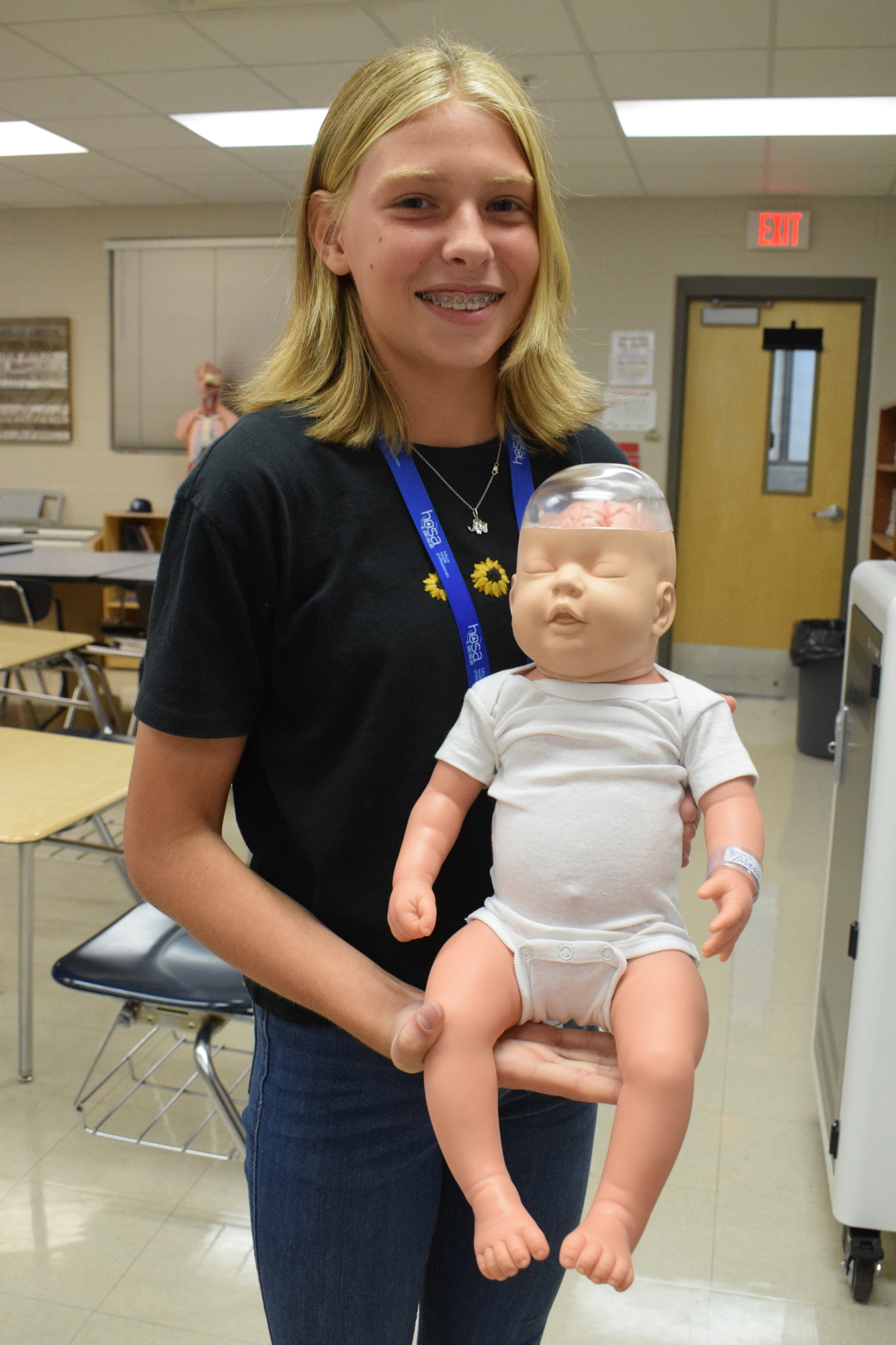 Payton Gee, an eighth grader at R. Dan Nolan Middle School, can learn how shaken baby syndrome impacts a baby's brain using a baby mannequin that was purchased using funding from the 1-mill ad valorem tax.