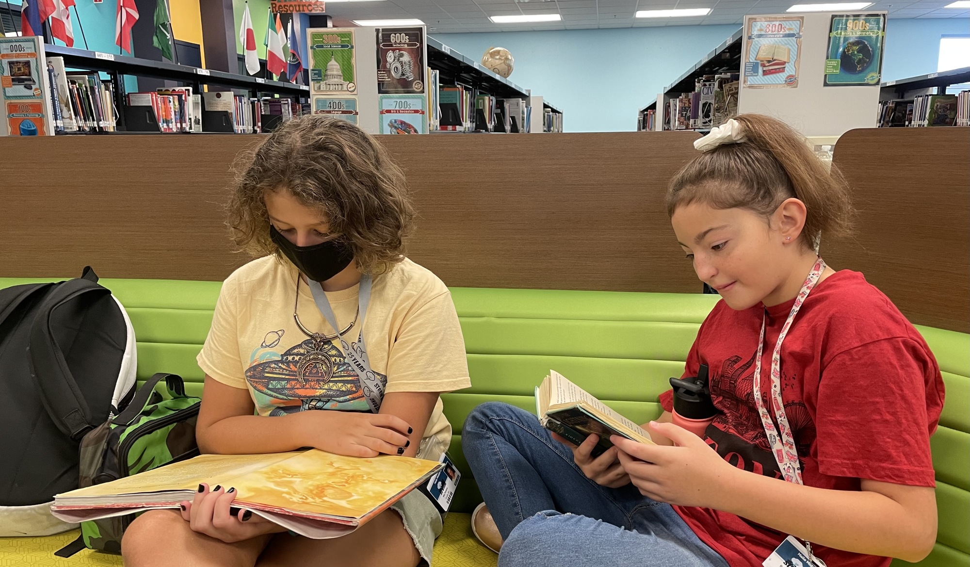 Carlos E. Haile Middle School sixth graders Mia Pereira and Bella Ashley read in the media center. School District of Manatee County students now have access to all Manatee County library resources through the All Access Pass.