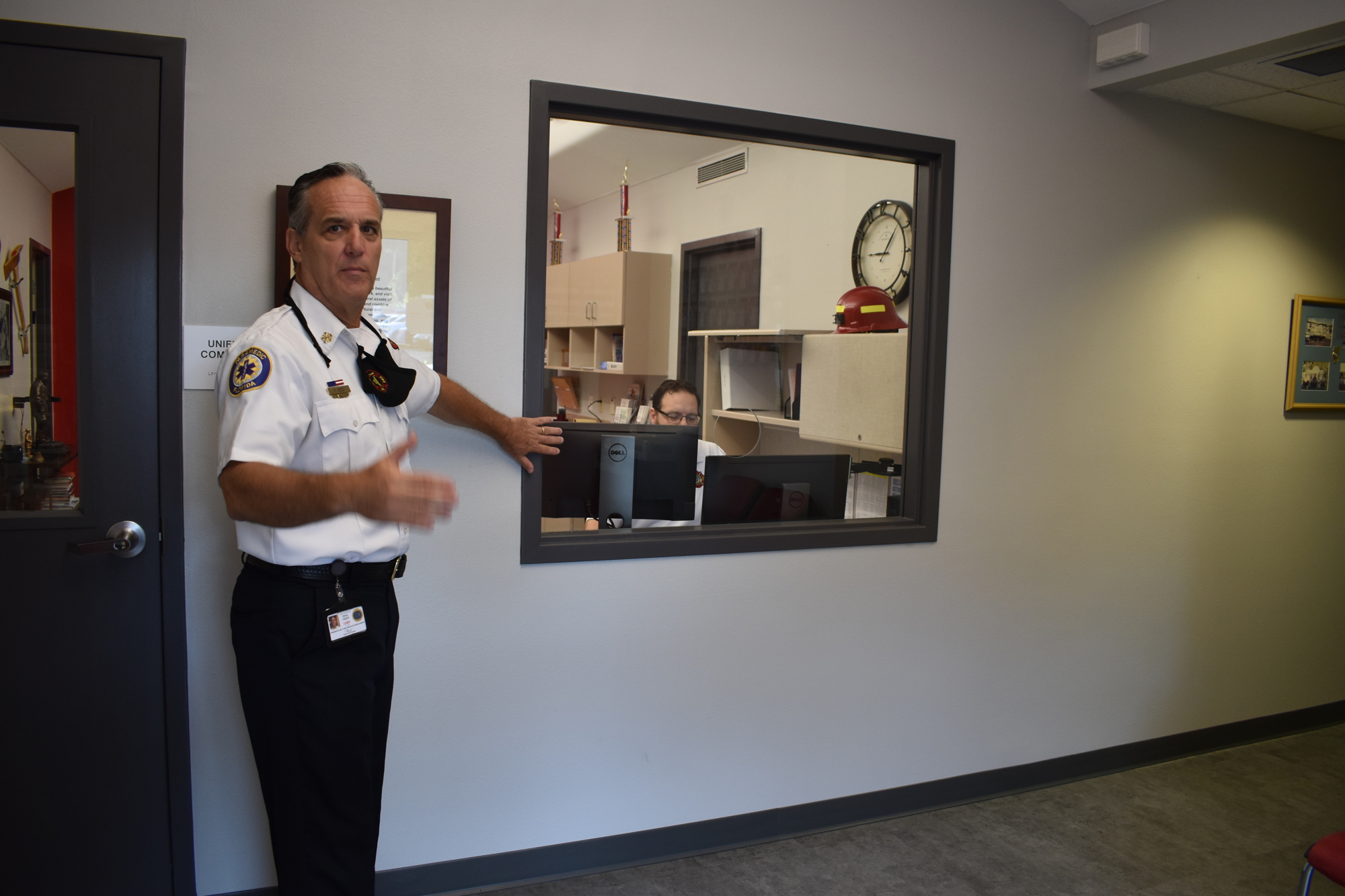 Fire Station 91's entrance has a waiting area for the public. Here Fire Chief Paul Dezzi is pictured next to Fire Rescue liaison Raymond Burger.