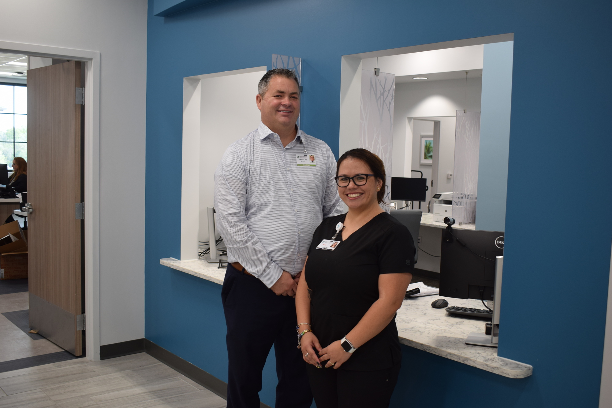 Dr. Duane Johnson and Office Manager Maria Patino greeted patients last week as the first business open at Waterside Place.
