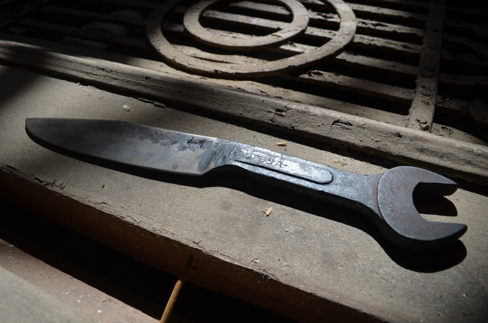 Blacksmith Bradley Dorrill forges knives, like this custom wrench/knife combination.