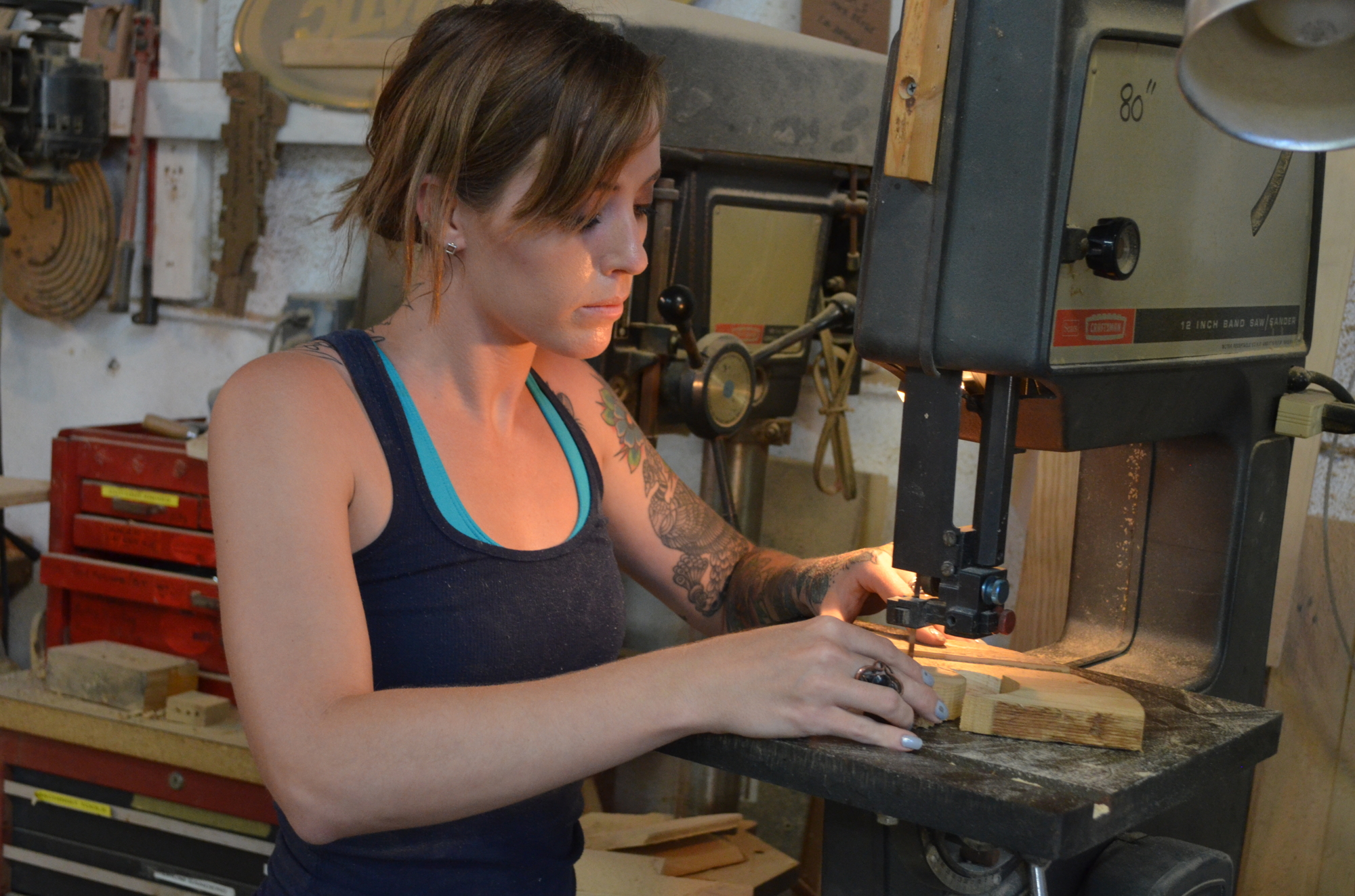 Tara Piedra works on a woodworking project.