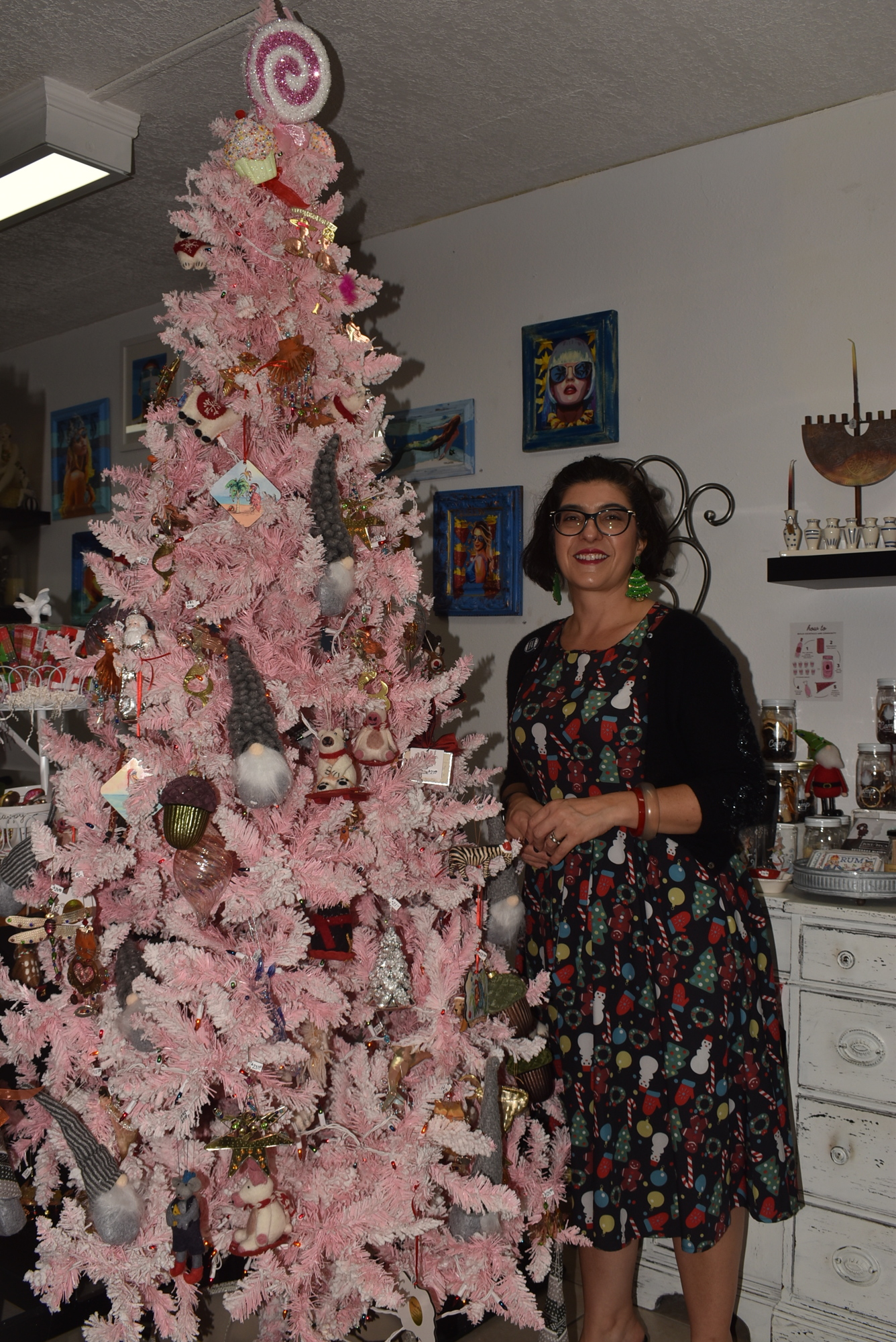 Just/Because owner Barbara Pugliese in her decorated store.