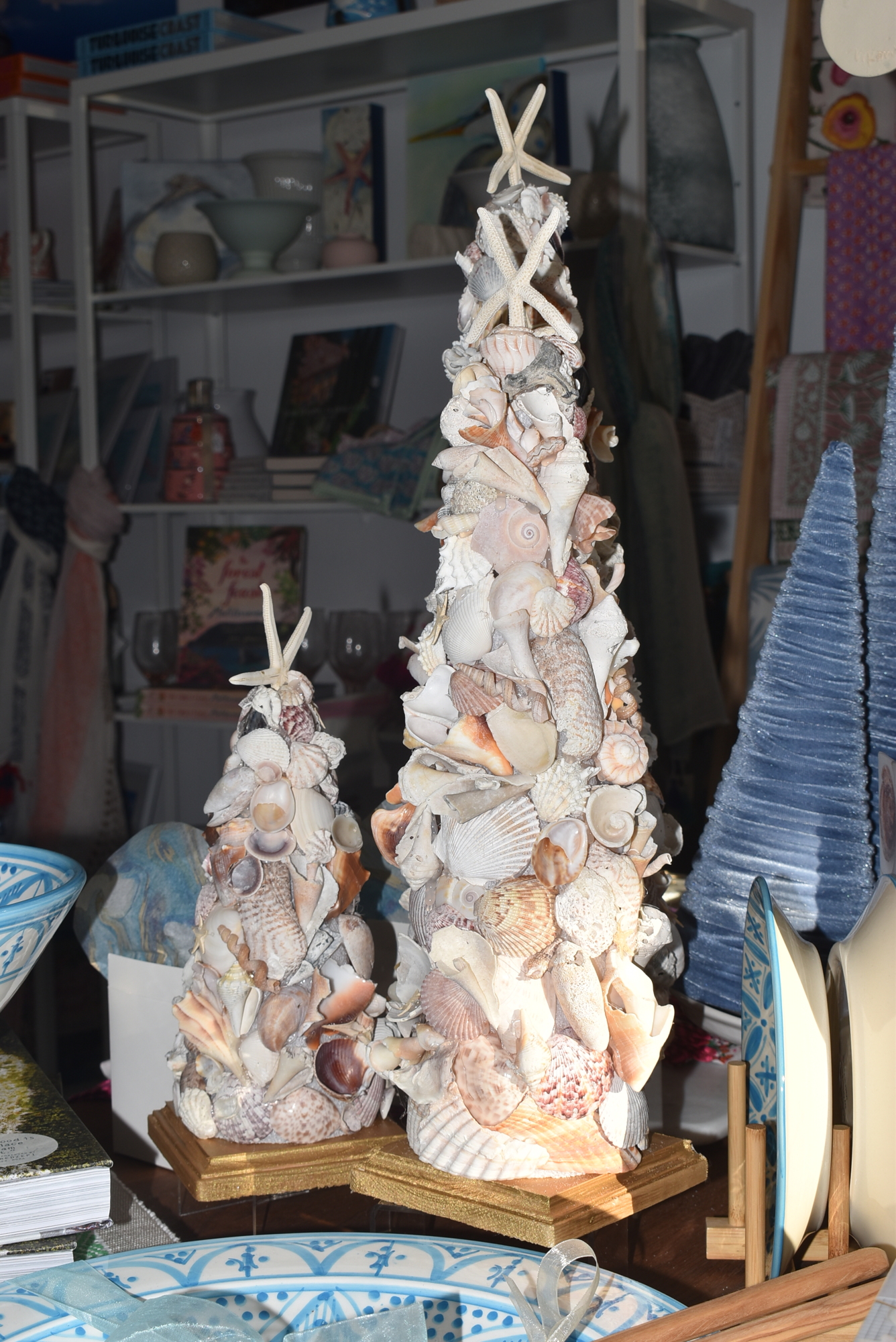 Heather Rippy decked out her store in local decorations like these trees covered in Longboat Key shells.