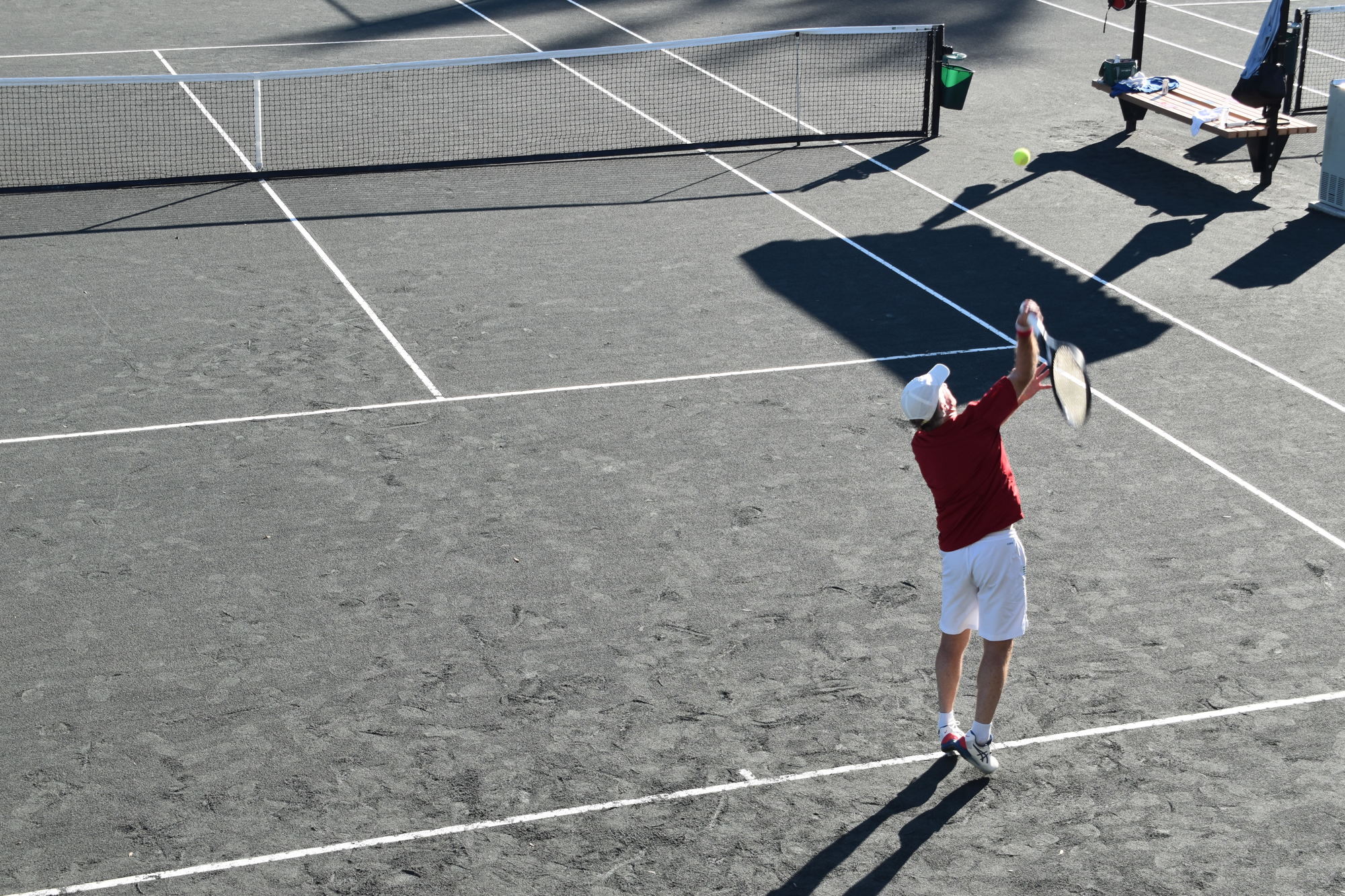 A player prepares a serve Monday in the tournament at the Longboat Key Public Tennis Center.