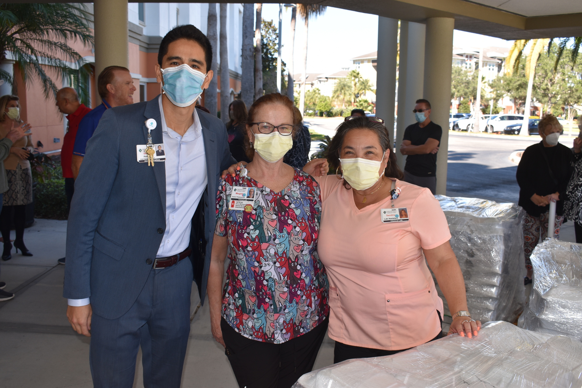 Lakewood Ranch Medical Center Chief Operating Officer Diego Perilla and staffers Megan Hartrnstein and Sandra Aguirre get set to enjoy a lunch thanks to the residents of Esplanade.