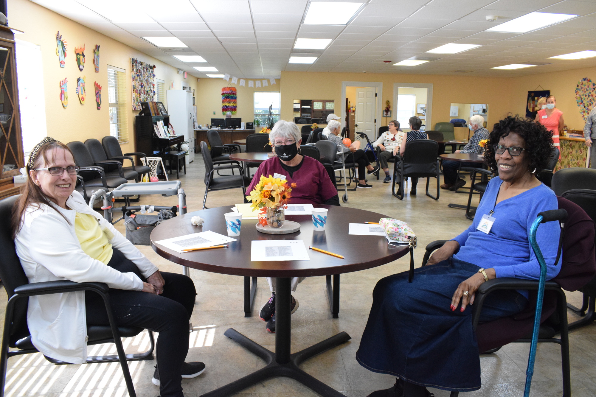 Daybreak Adult Day Center client Barbara Roberge talks with staff member Mari Holland and her friend Dorothy Prileau, who also is a client.
