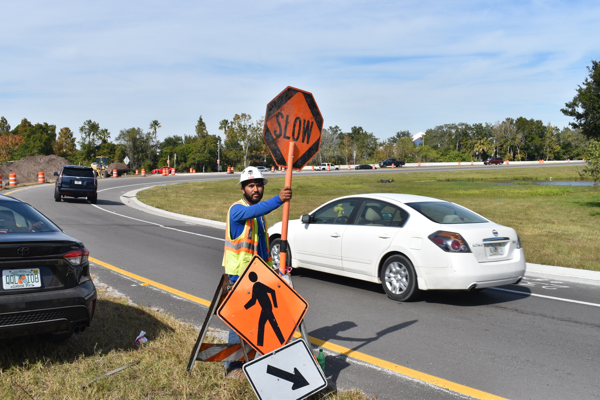 Richard Delarosa of Sacyr Construction helps guide traffic coming from the east on S.R. 70 onto the southbound on-ramp for Interstate 75 on Dec. 3.