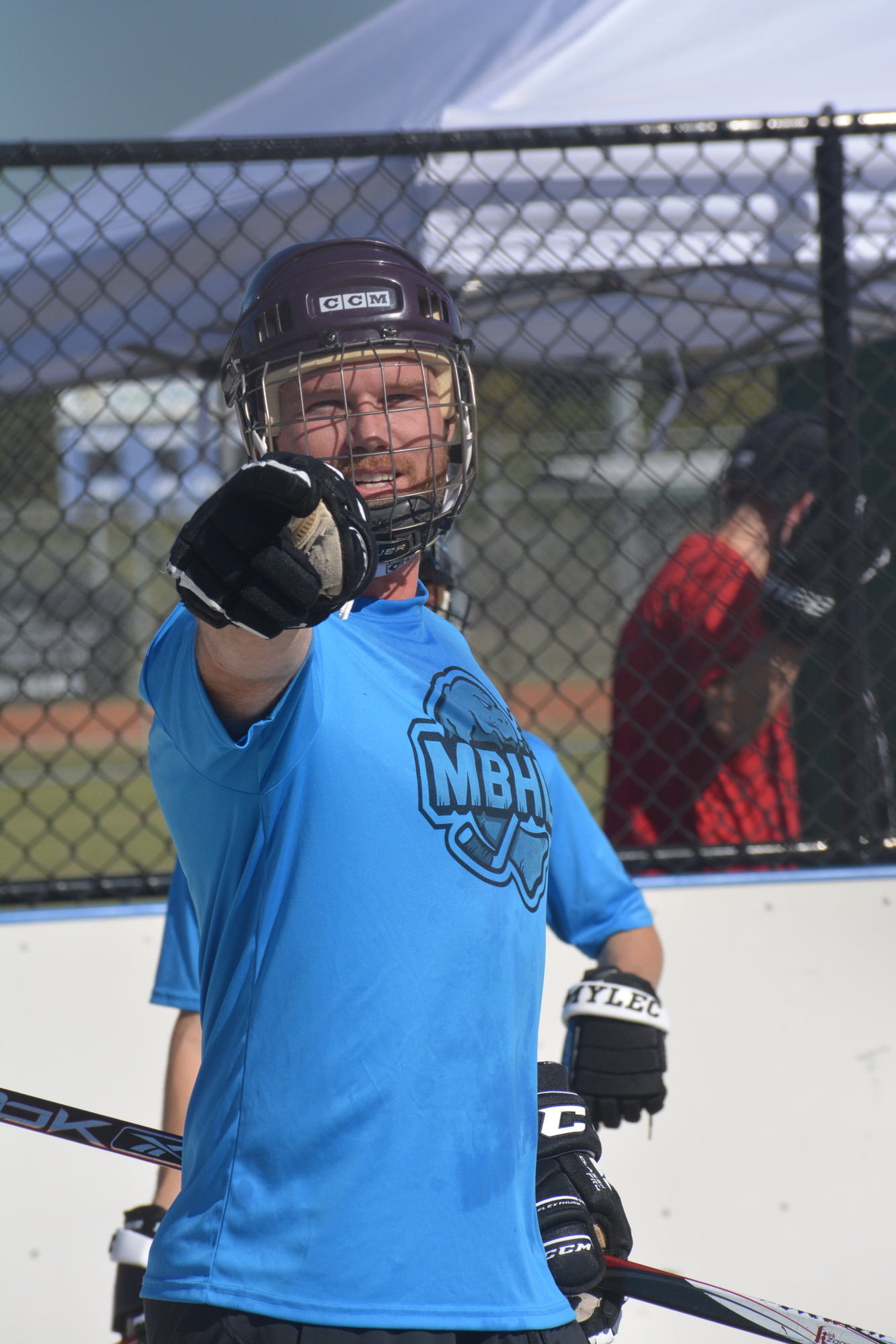 Austin Edgar hams to the camera after scoring a goal in a Manatee Ball Hockey League game Dec. 4. Edgar said the league has helped him learn more about the sport.