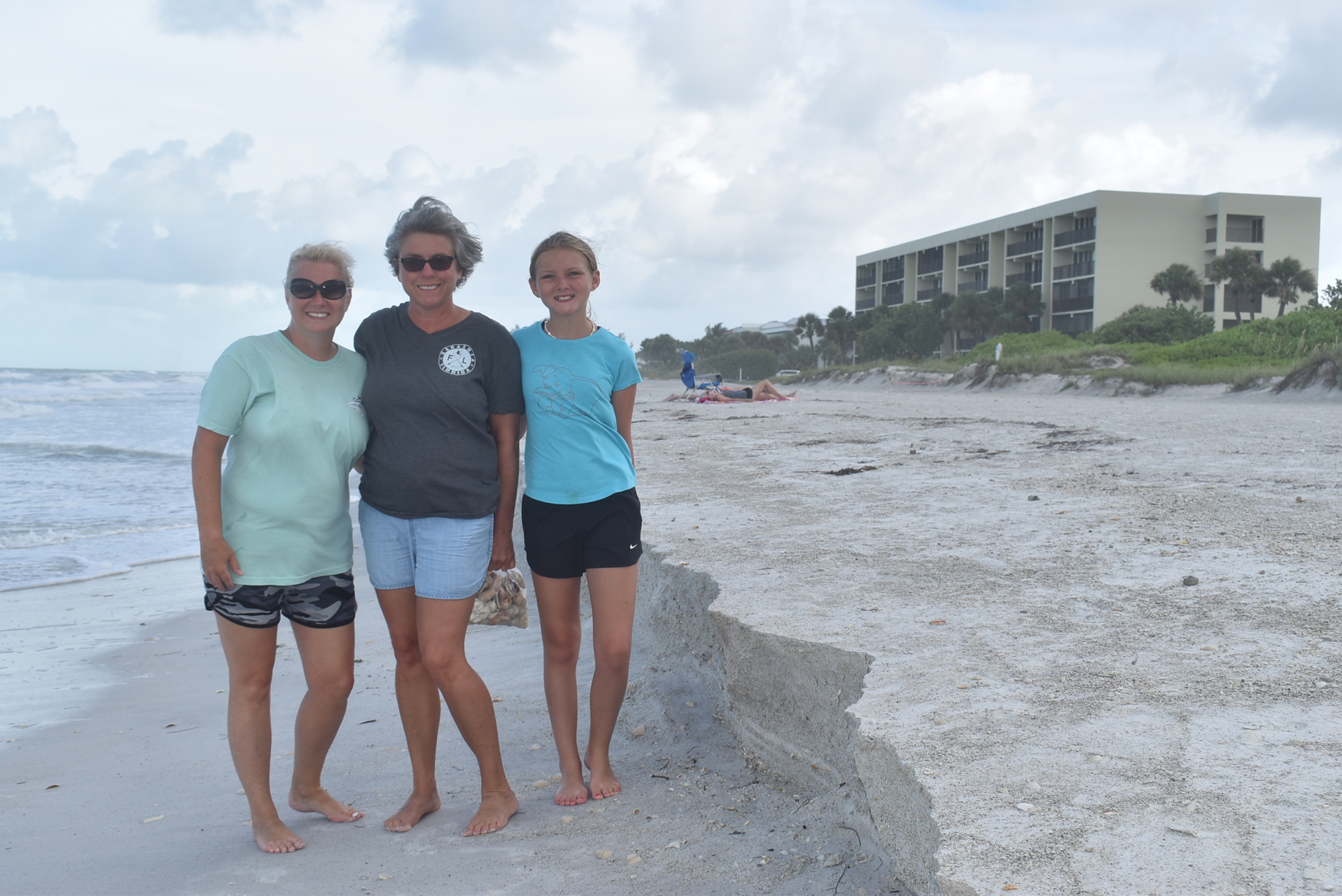JULY: Amy Baker, Lysette Daniels and Marisa Baker check out the beach erosion in the 3100 block of Gulf of Mexico Drive in Longboat Key.