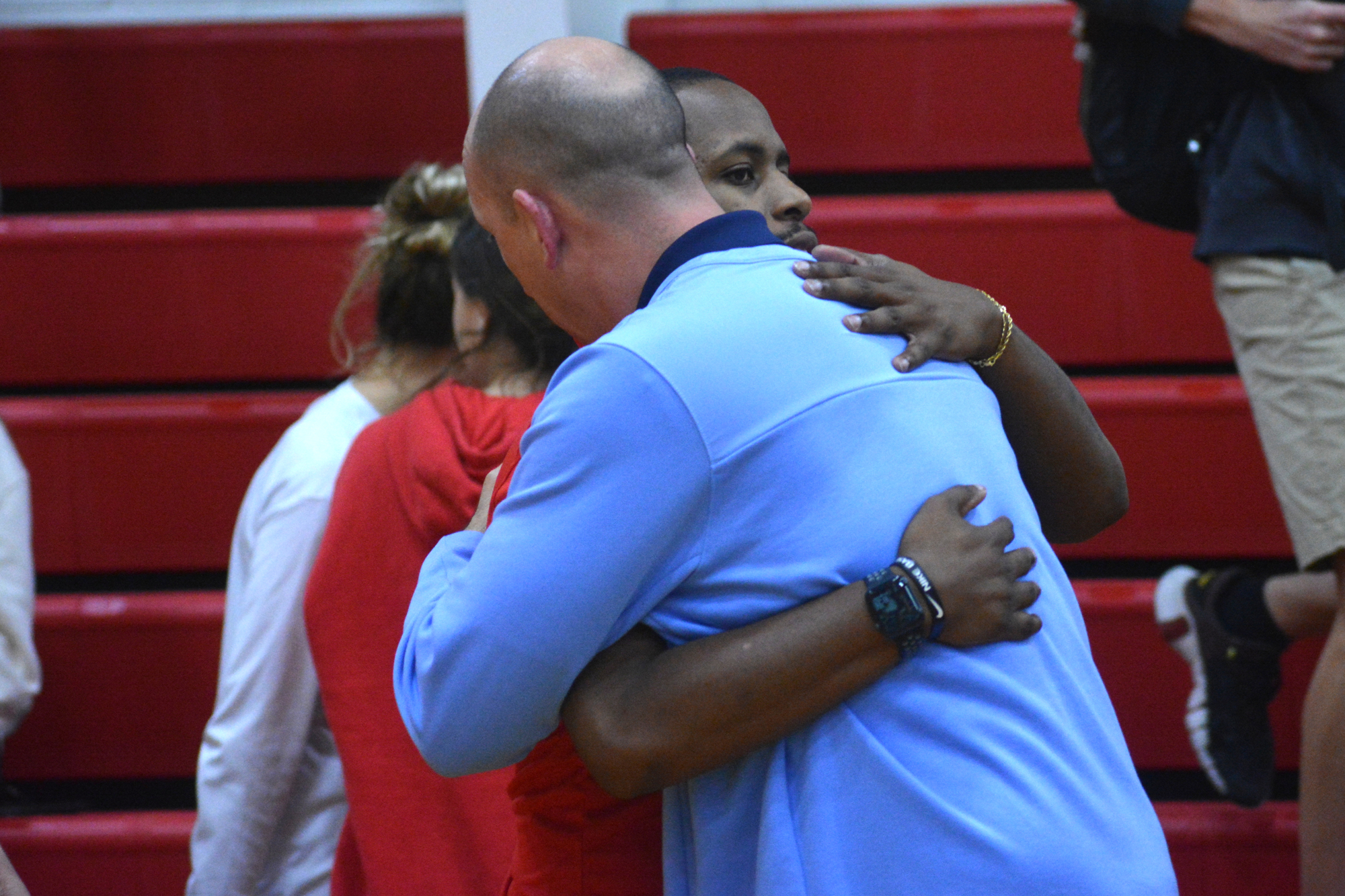Cardinal Mooney High boys basketball Coach Vince Cherry hugs ODA Coach B.J. Ivey after the two teams played each other. Cherry played for Ivey at Riverview High.
