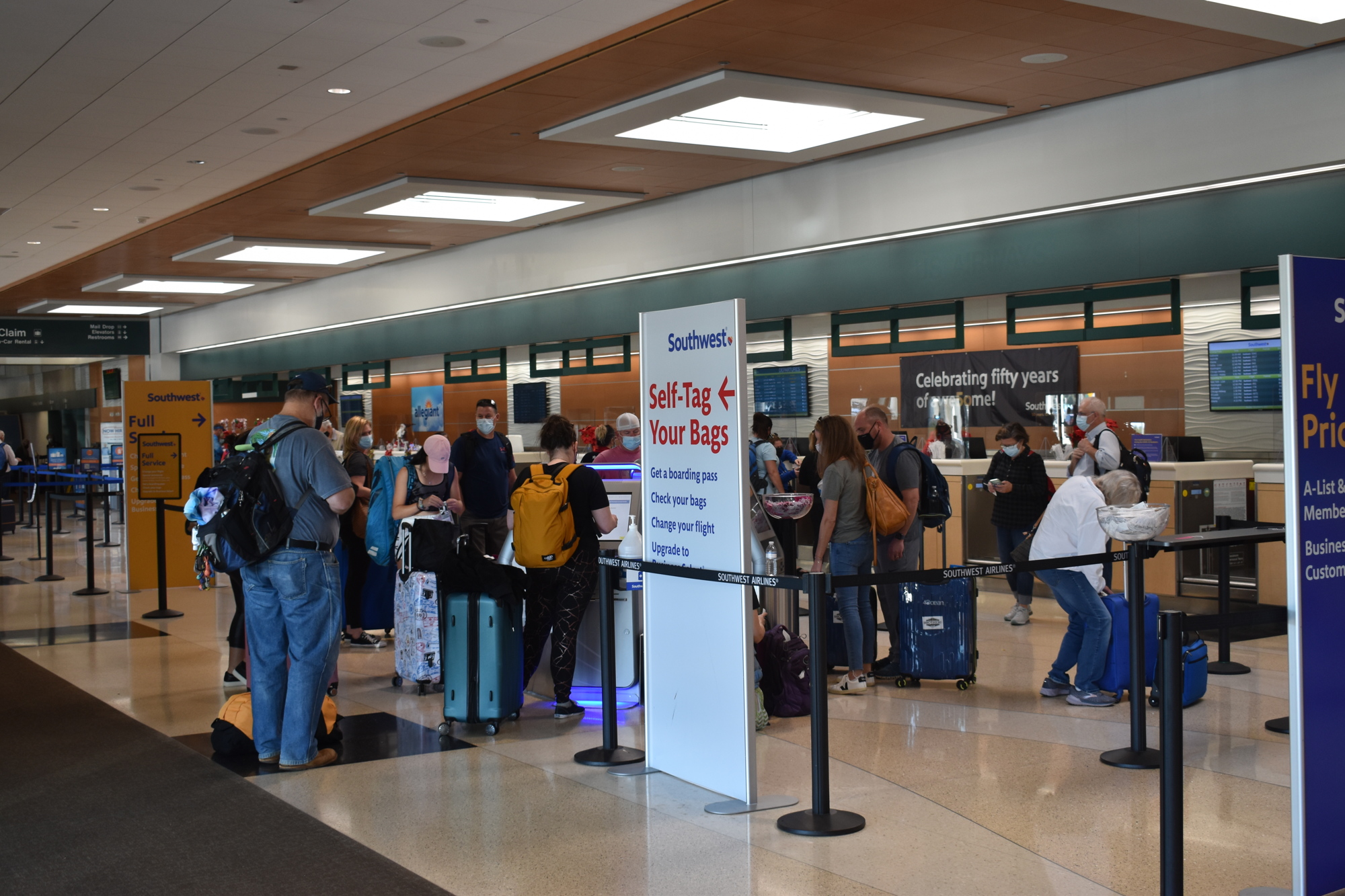 Passengers wait to check in for flights at the Sarasota-Bradenton International Airport. The airport expects to see more than 10,000 passengers on Dec. 23.