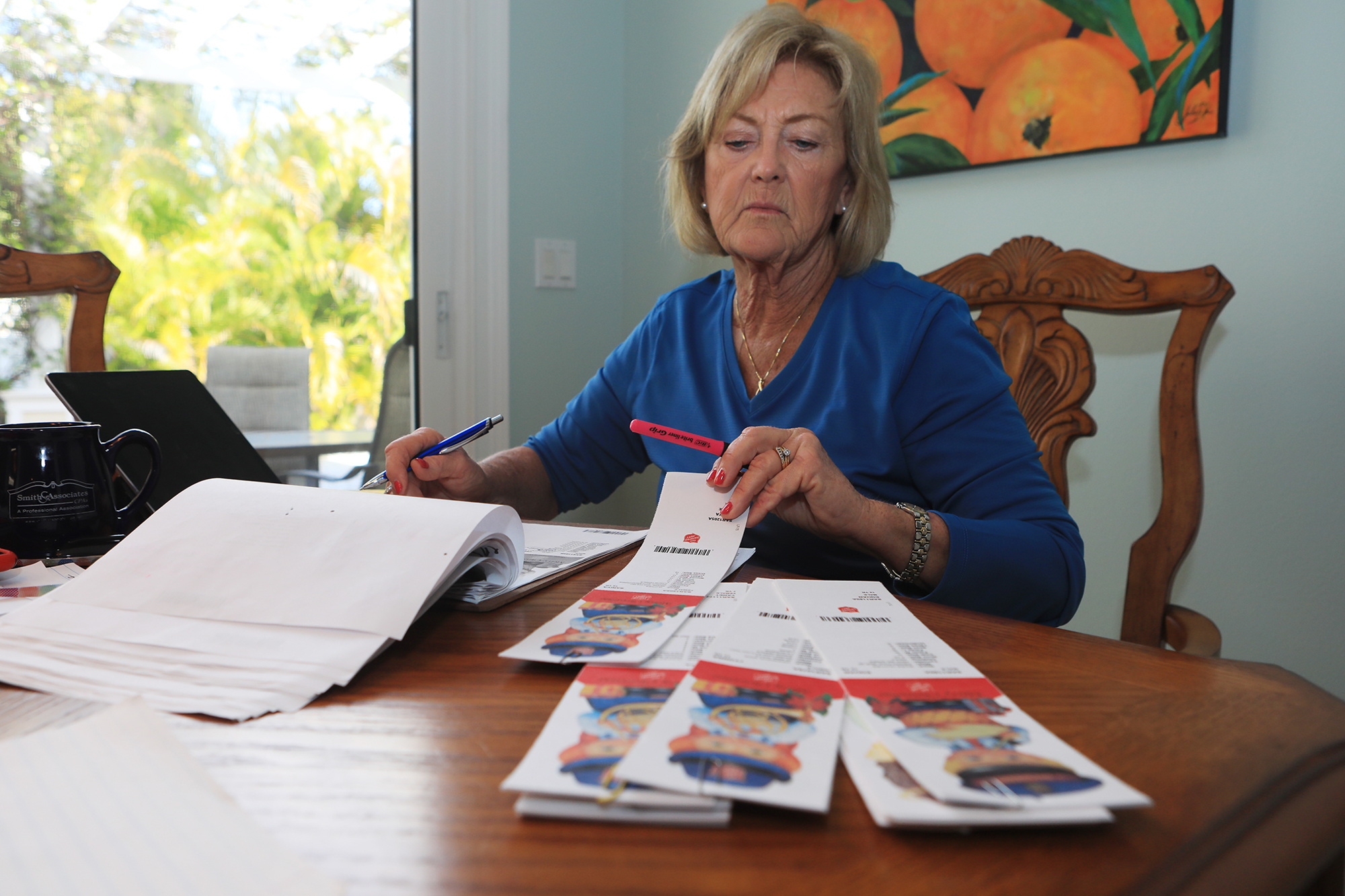 Julie DeRice spends hours matching tags to presents so they can be shipped out.