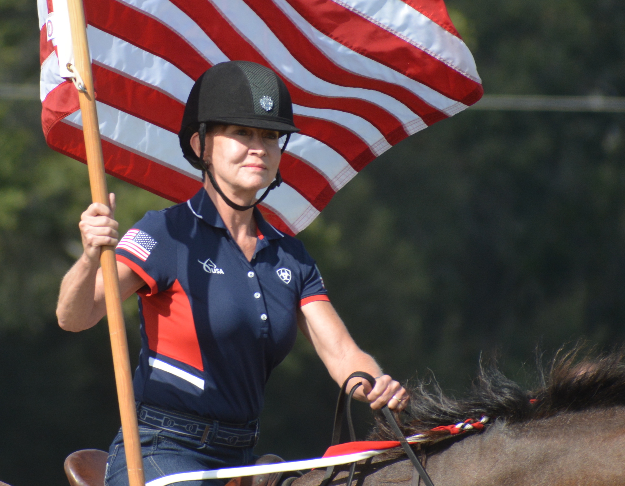 Misdee Miller often presents the colors at the Sarasota Polo Club.