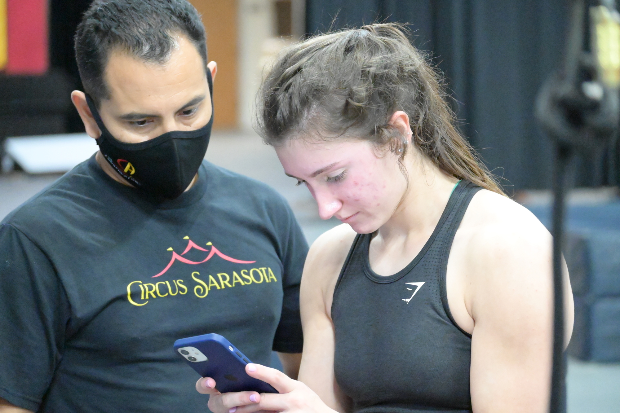 Coach Miguel Vargas and student Lila Watkins share a quiet moment during rehearsal. (Photo: Spencer Fordin)