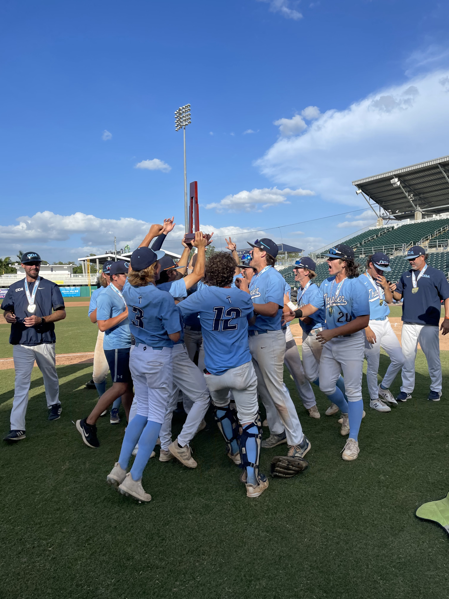 4. The ODA baseball team celebrates after defeating St. Johns Country Day 5-3 to win the state title.