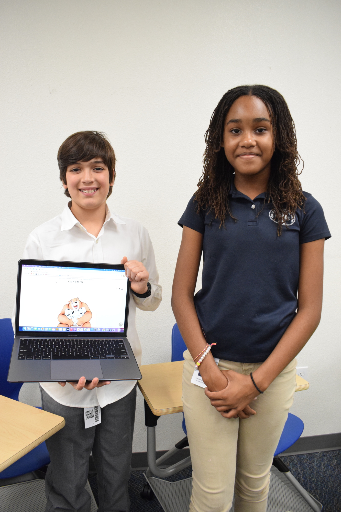 Eighth grader Jason Luedeke and sixth grader Starlla Jackson create a website to show off the jingle they created for a Charmin commercial.