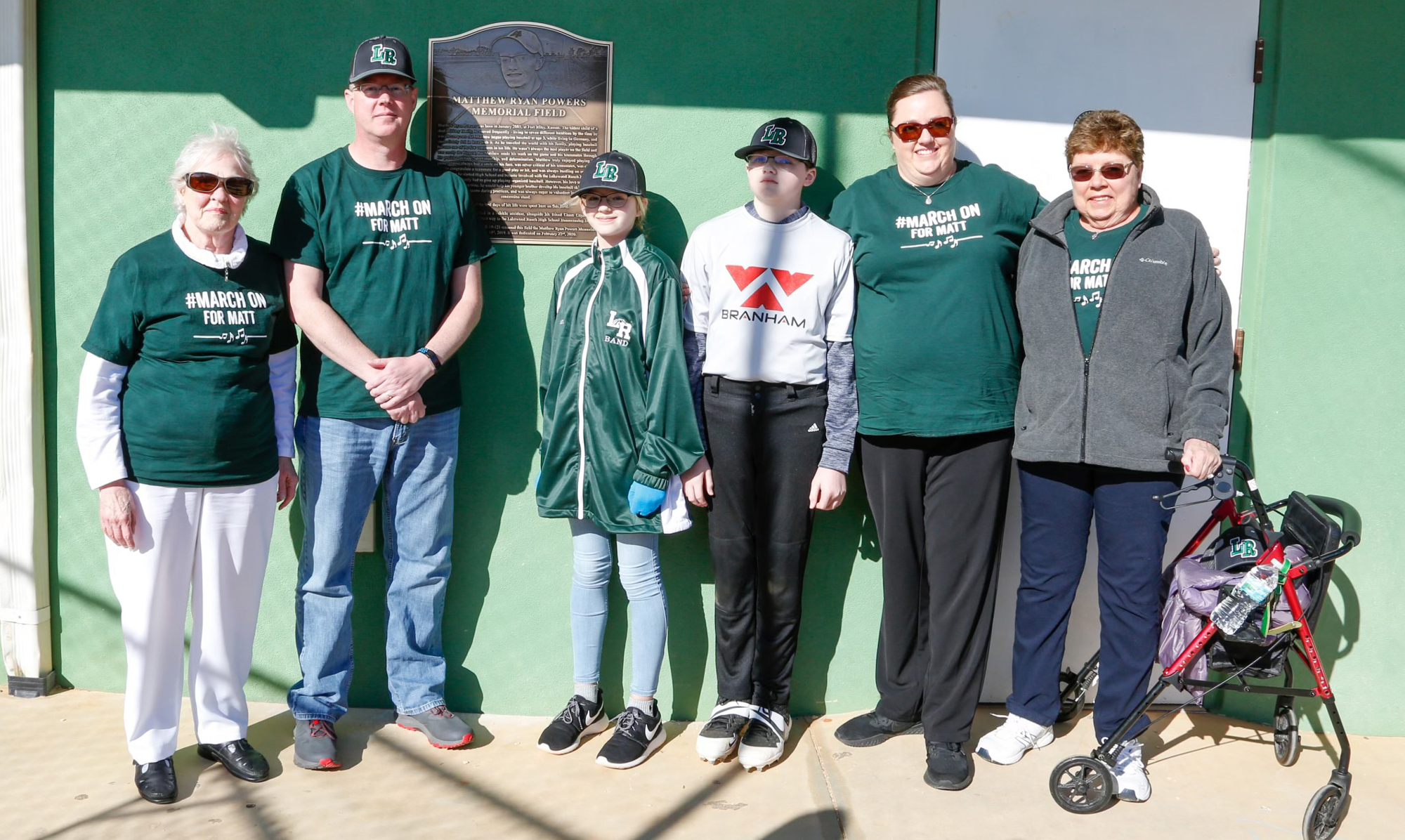 Mary Powers, Dan Powers, Katie Powers, Robert Powers and Claudia Geist stand next to a plaque honoring Matthew Powers. Photo provided.