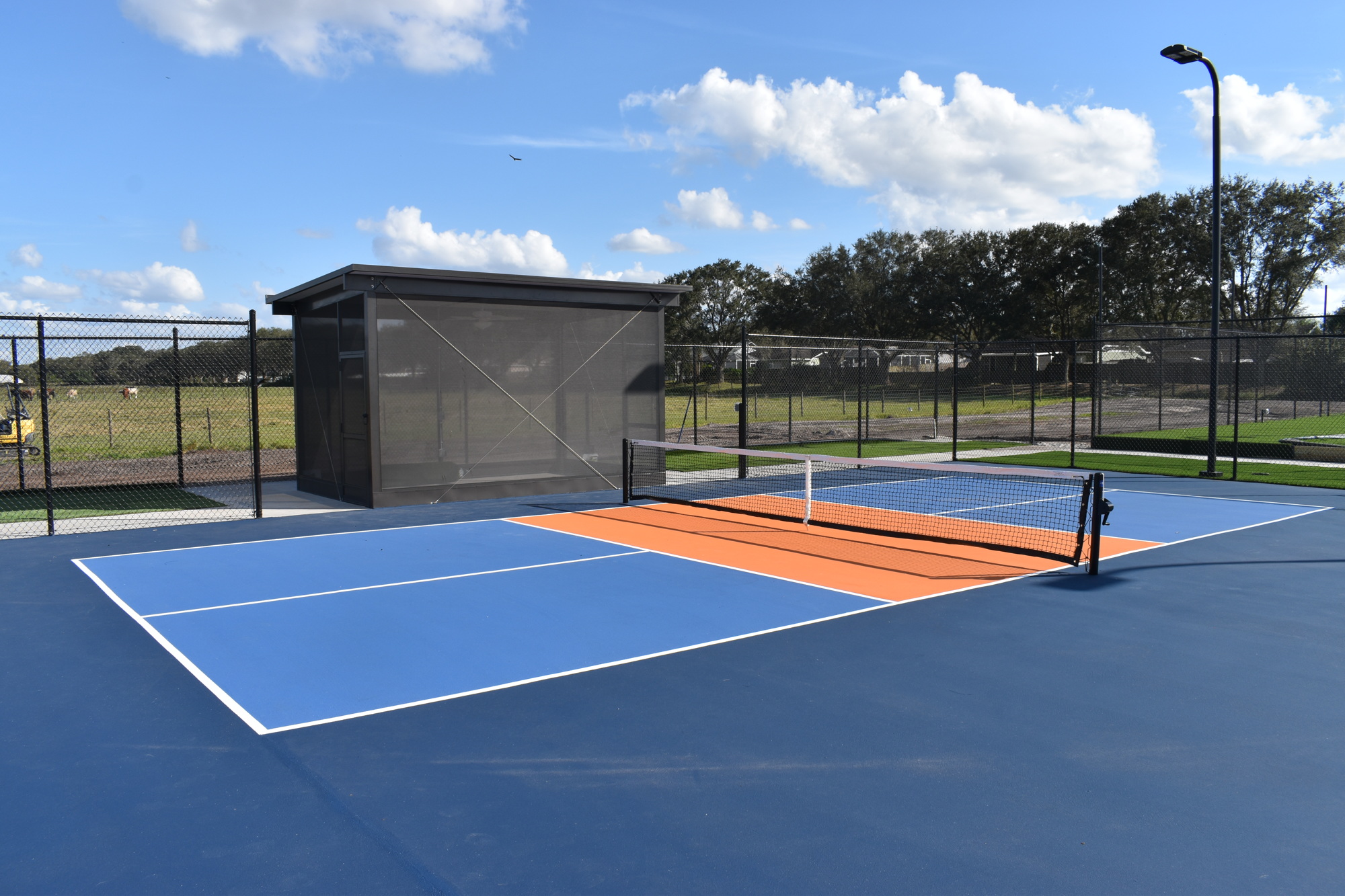 The first phase of construction of the UMR Sports complex features six pickleball courts and a screened structure that will be used as a lounge for members.
