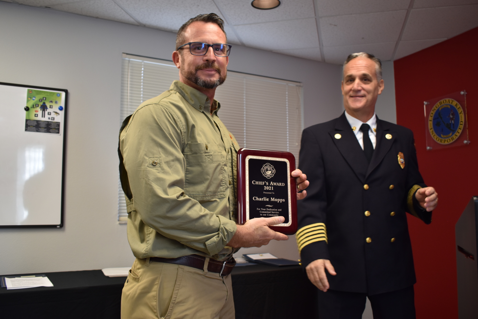 Fire Chief Paul Dezzi (right) recognized Charlie Mopps (left) in November 2021 with the Chief’s Award. (File photo)