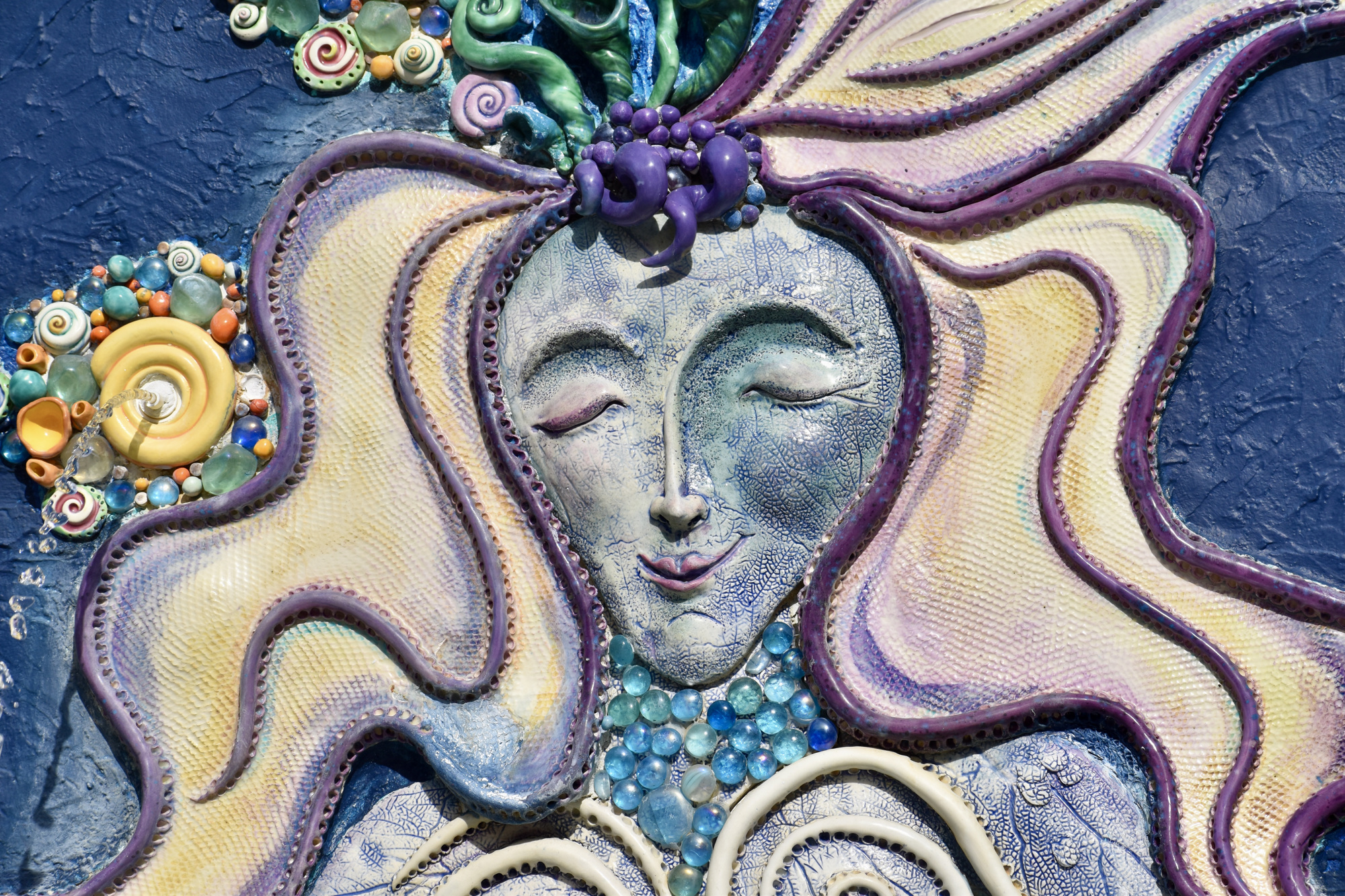 Whimsical artwork adorns the centerpiece of the park, a mermaid fountain crafted by Nancy Goodheart Matthews.