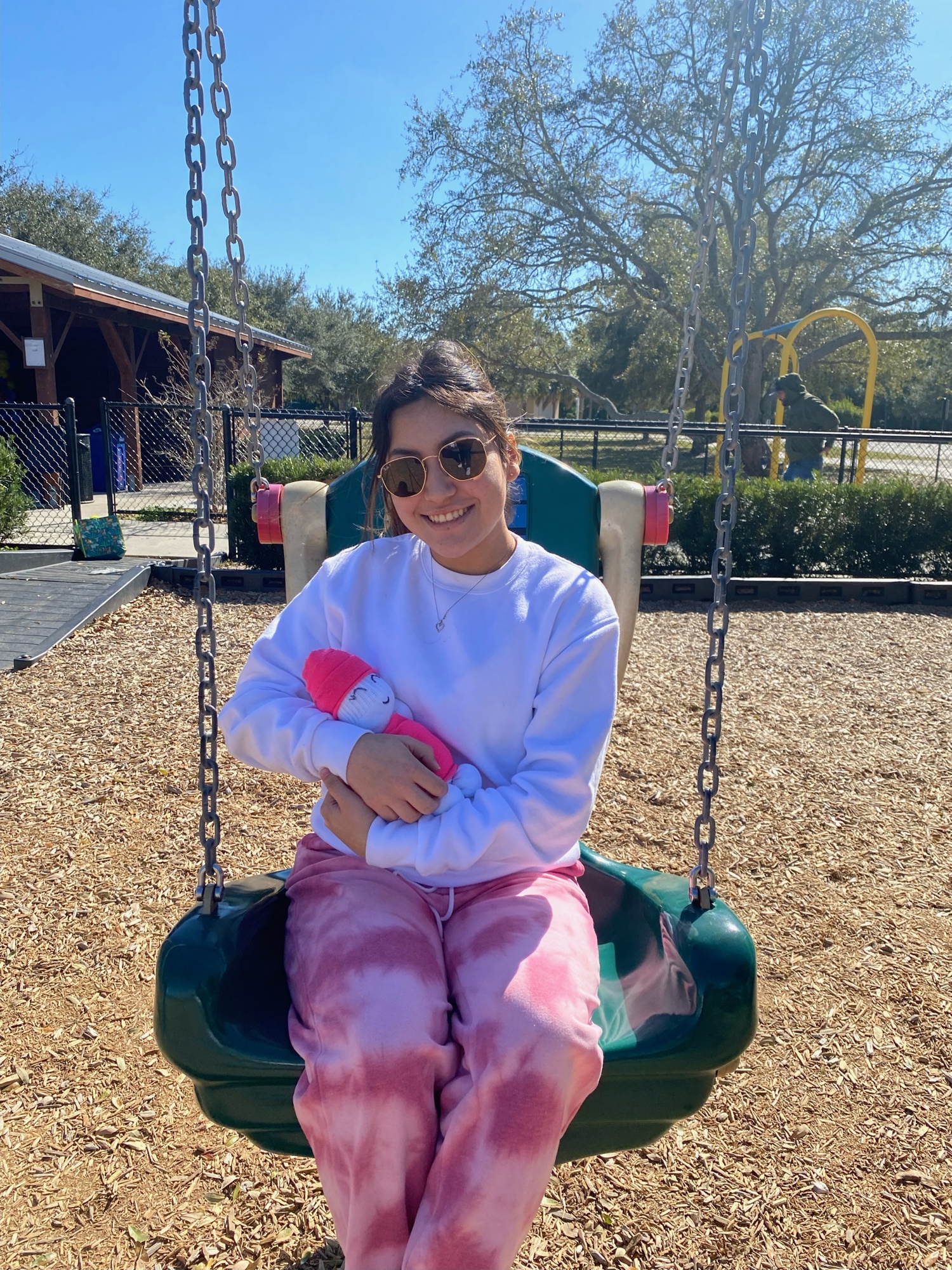 Junior Evelyn Sanchez takes her sock baby, Luna, to the park. They have a blast on the swings. Courtesy photo.